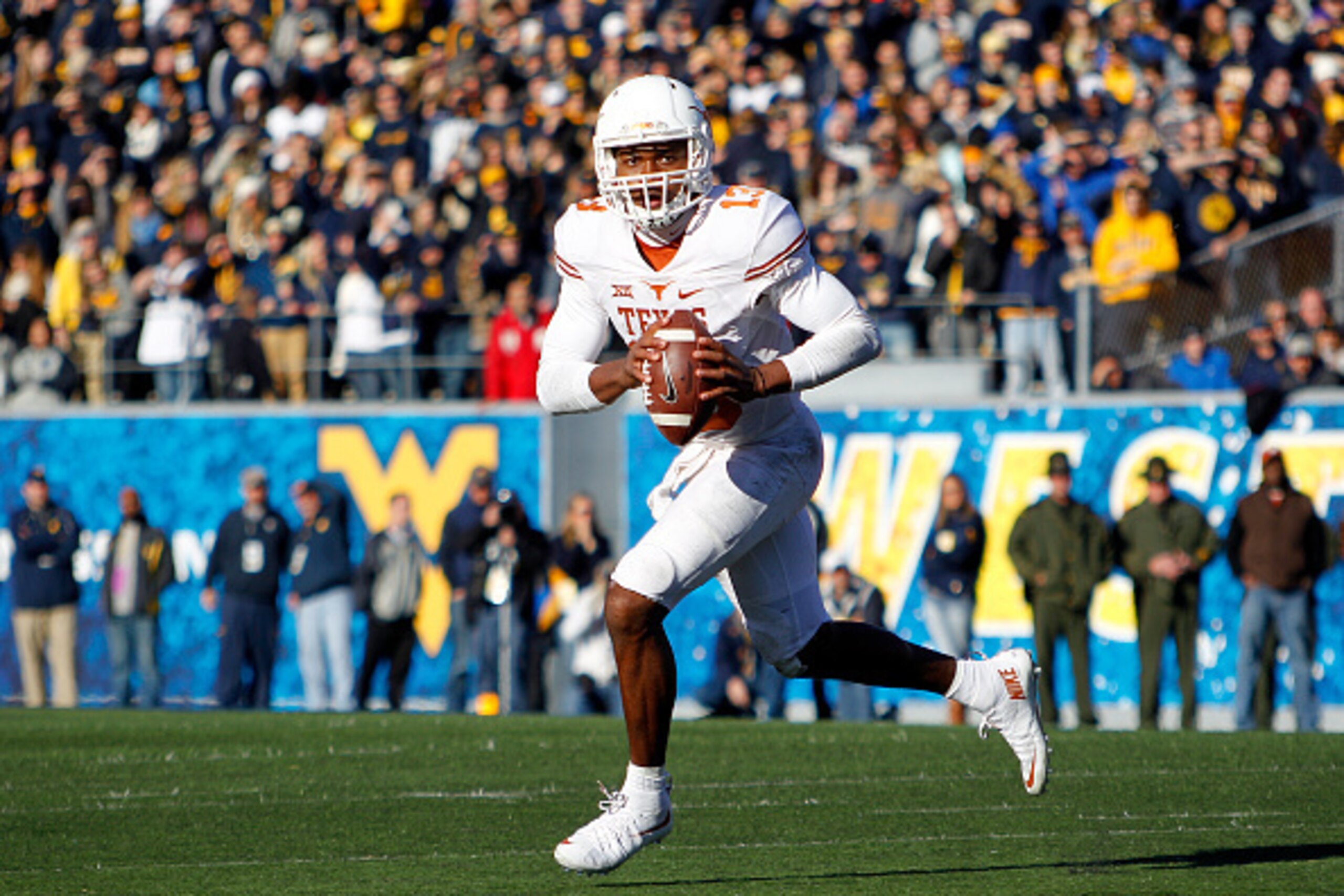 MORGANTOWN, WV - NOVEMBER 14:  Jerrod Heard #13 of the Texas Longhorns in action during the game against the West Virginia Mountaineers on November 14, 2015 at Mountaineer Field in Morgantown, West Virginia.  (Photo by Justin K. Aller/Getty Images)
