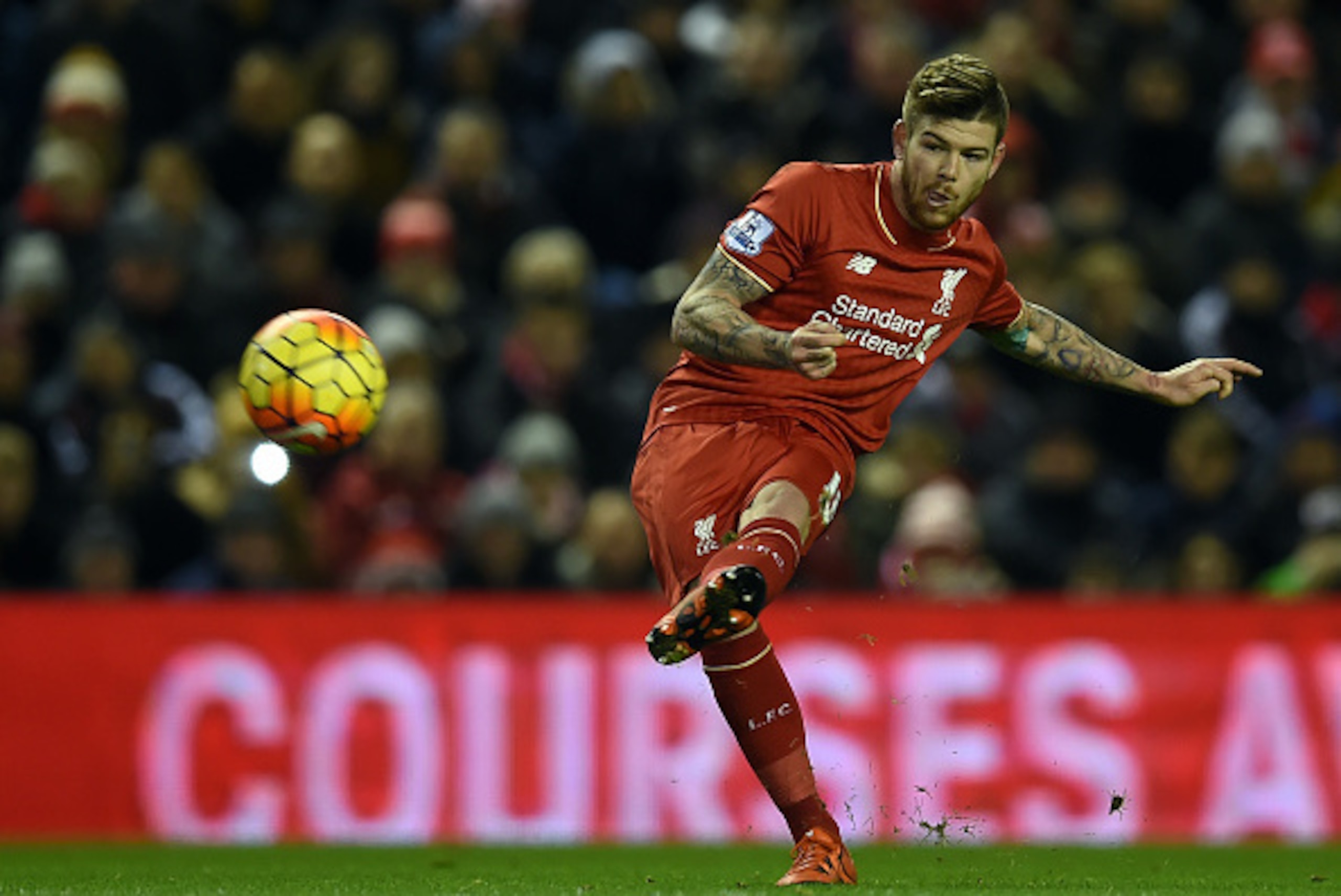 Liverpool's Spanish defender Alberto Moreno takes a freekick during the English Premier League football match between Liverpool and Swansea City at the Anfield stadium in Liverpool, north-west England on November 29, 2015.    / AFP / PAUL ELLIS        (Ph
