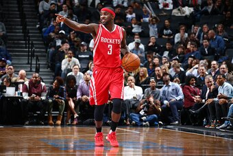 BROOKLYN, NY - DECEMBER 8: Ty Lawson #3 of the Houston Rockets handles the ball during the game against the Brooklyn Nets on December 8, 2015 at Barclays Center in Brooklyn, New York. NOTE TO USER: User expressly acknowledges and agrees that, by downloadi