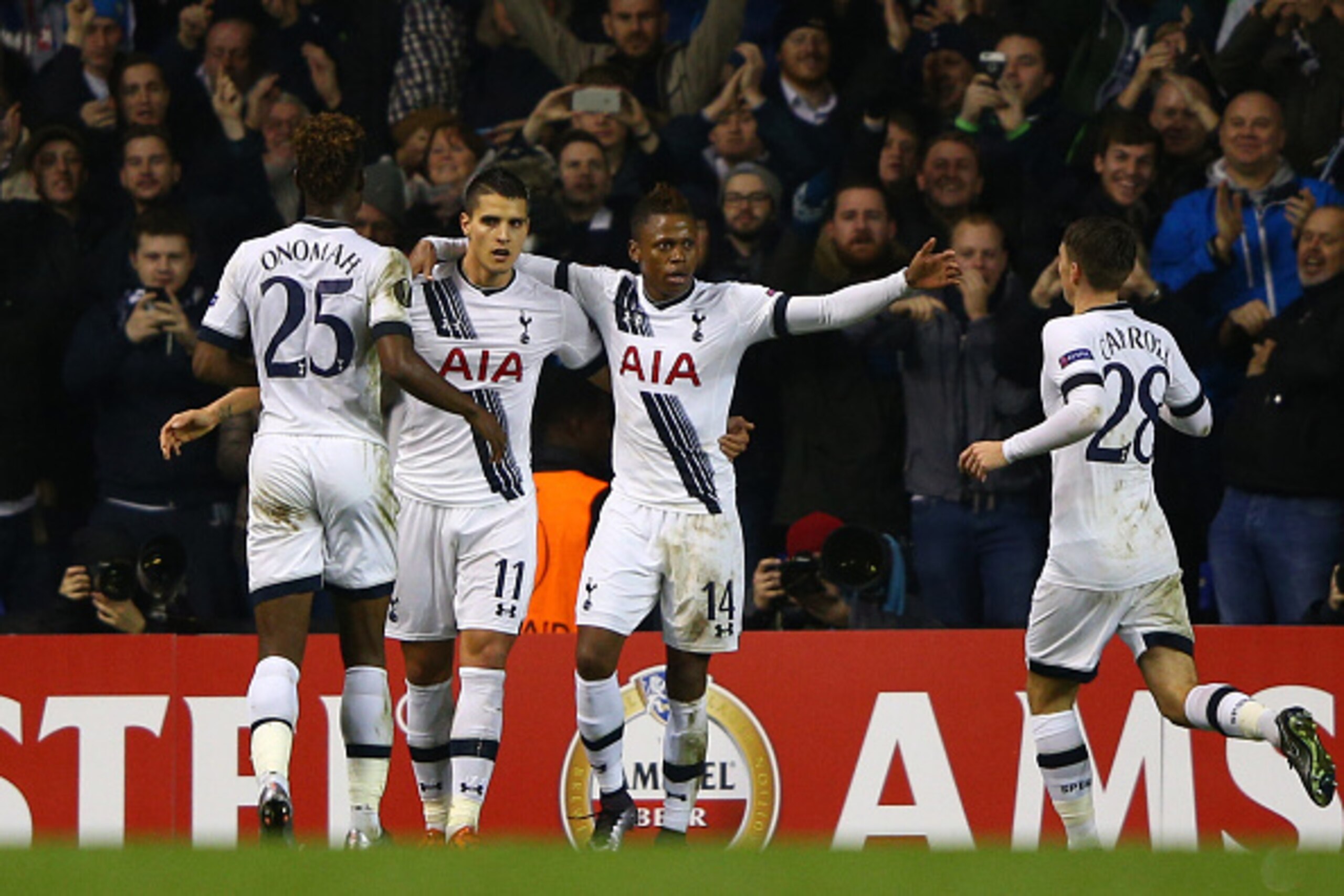 LONDON, ENGLAND - DECEMBER 10:  Erik Lamela #11 of Spurs is congratulated by teammates after scoring his team's third goal and completing his hat trick during the UEFA Europa League Group J match between Tottenham Hotspur and AS Monaco at White Hart Lane 