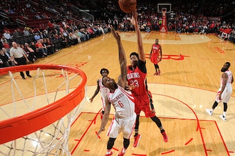 HOUSTON, TX - DECEMBER 2:  Anthony Davis #23 of the New Orleans Pelicans shoots against Terrence Jones #6 of the Houston Rockets on December 2, 2015 at the Toyota Center in Houston, Texas. NOTE TO USER: User expressly acknowledges and agrees that, by down