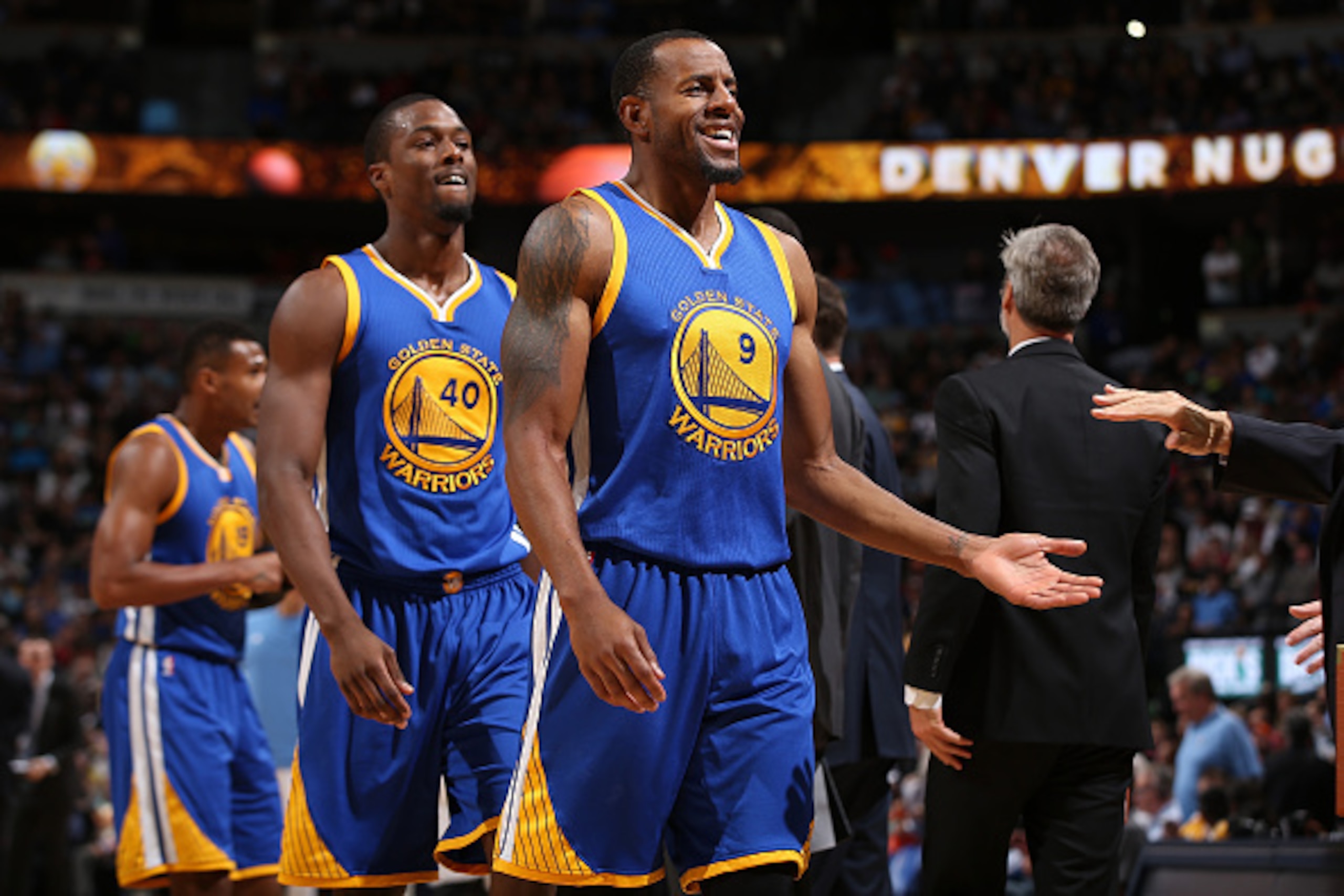 DENVER, CO - NOVEMBER 22:  Andre Iguodala #9, Harrison Barnes #40 and Leandro Barbosa #19 of the Golden State Warriors celebrate against the Denver Nuggets at Pepsi Center on November 22, 2015 in Denver, Colorado. The Warriors defeated the Nuggets 118-105
