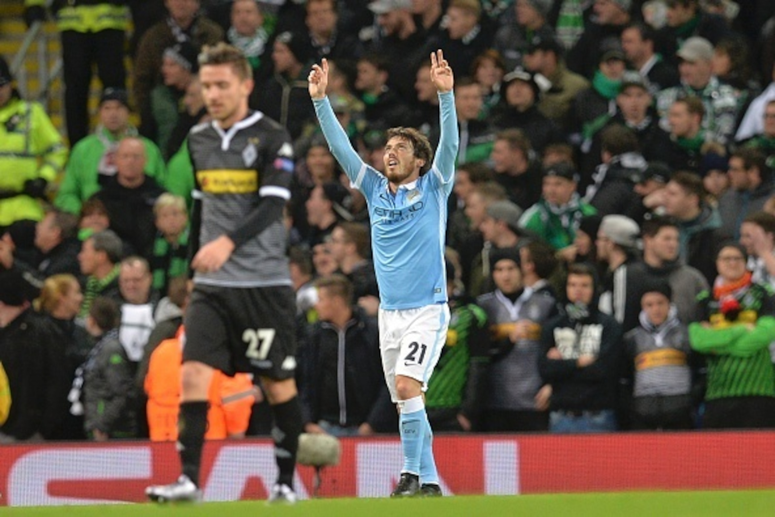 Manchester City's Spanish midfielder David Silva celebrates scoring the opening goal during the UEFA Champions League Group D football match between Manchester City and Borussia Moenchengladbach at the Etihad Stadium in Manchester, northwest England, on D