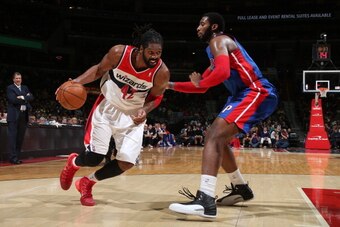 WASHINGTON, DC - DECEMBER 28: Nene #42 of the Washington Wizards drives against the Detroit Pistons during the game at the Verizon Center on December 28, 2013 in Washington, DC. NOTE TO USER: User expressly acknowledges and agrees that, by downloading and