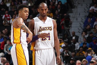AUBURN HILLS, MI - DECEMBER 6:  Kobe Bryant #24 and D'Angelo Russell #1 of the Los Angeles Lakers talk during the game against the Detroit Pistons on December 6, 2015 at The Palace of Auburn Hills in Auburn Hills, Michigan. NOTE TO USER: User expressly ac