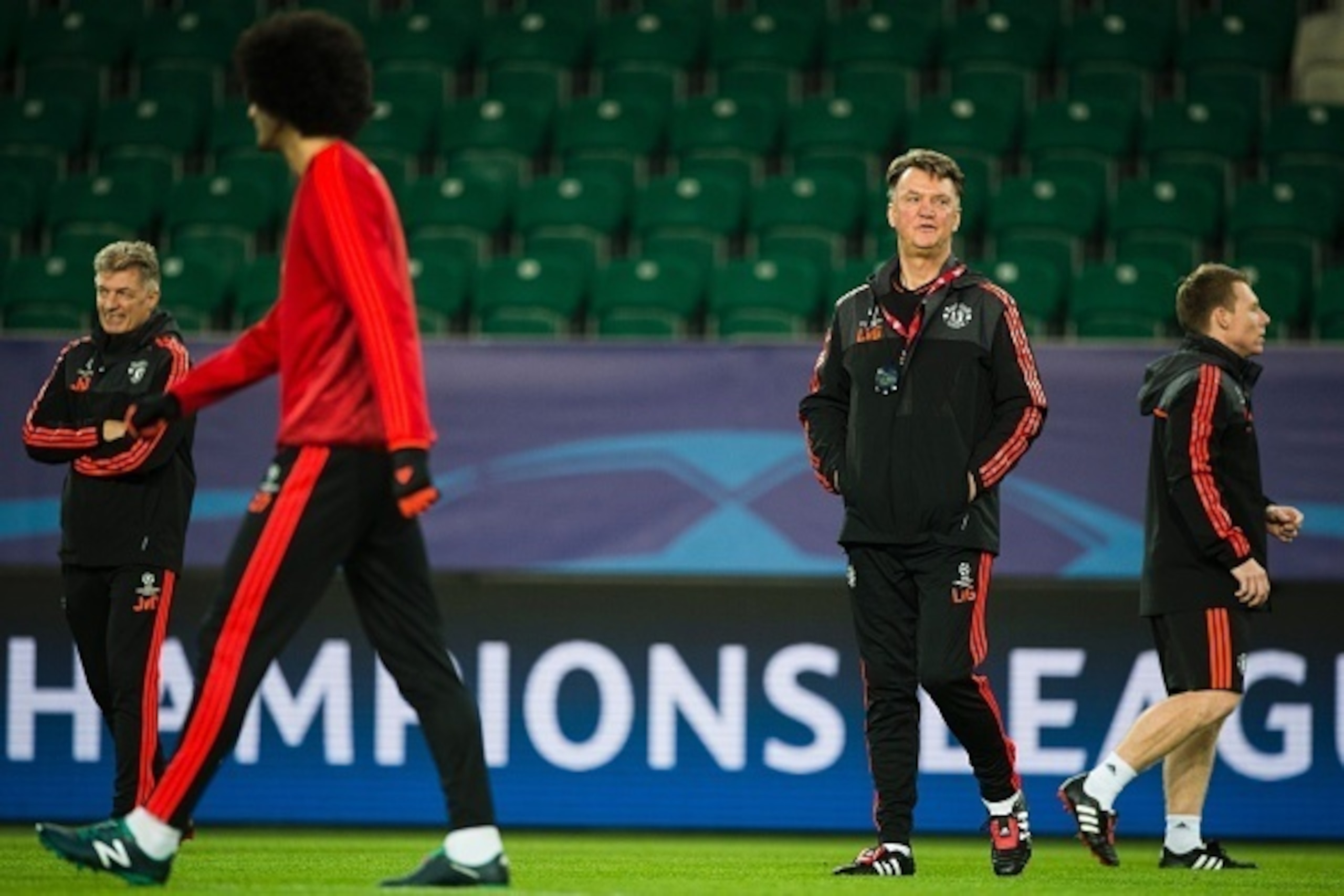 Manchester United's Dutch manager Louis van Gaal (2nd R) attends a training session in Wolfsburg, central Germany, on December 7, 2015, one the eve of the UEFA Champions League Group B second-leg football match VfL Wolfsburg vs Manchester United. AFP PHOT
