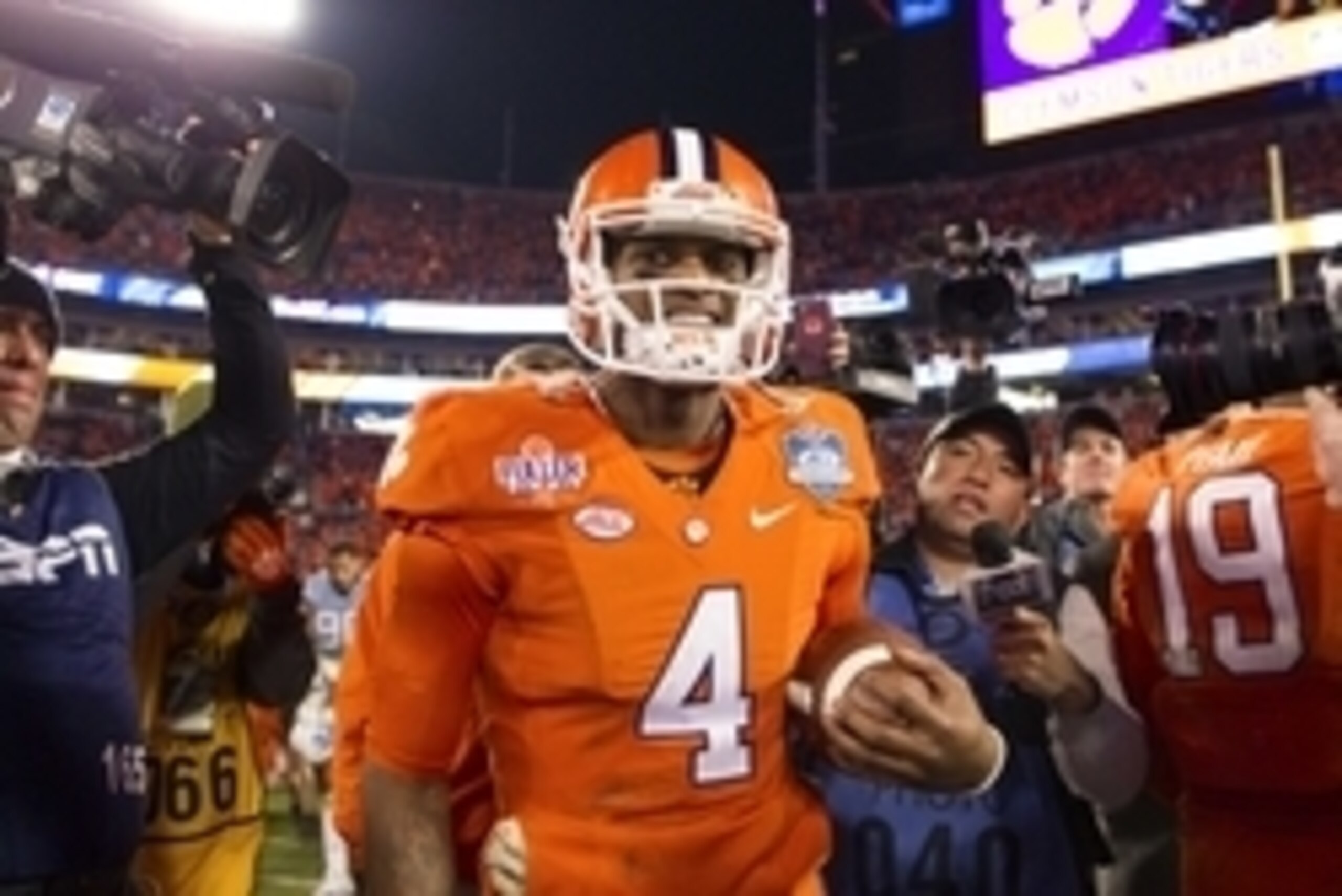Dec 5, 2015; Charlotte, NC, USA; Clemson Tigers quarterback Deshaun Watson (4) walks off the field after defeating the North Carolina Tar Heels 45-37 in the ACC football championship game at Bank of America Stadium. Mandatory Credit: Joshua S. Kelly-USA T