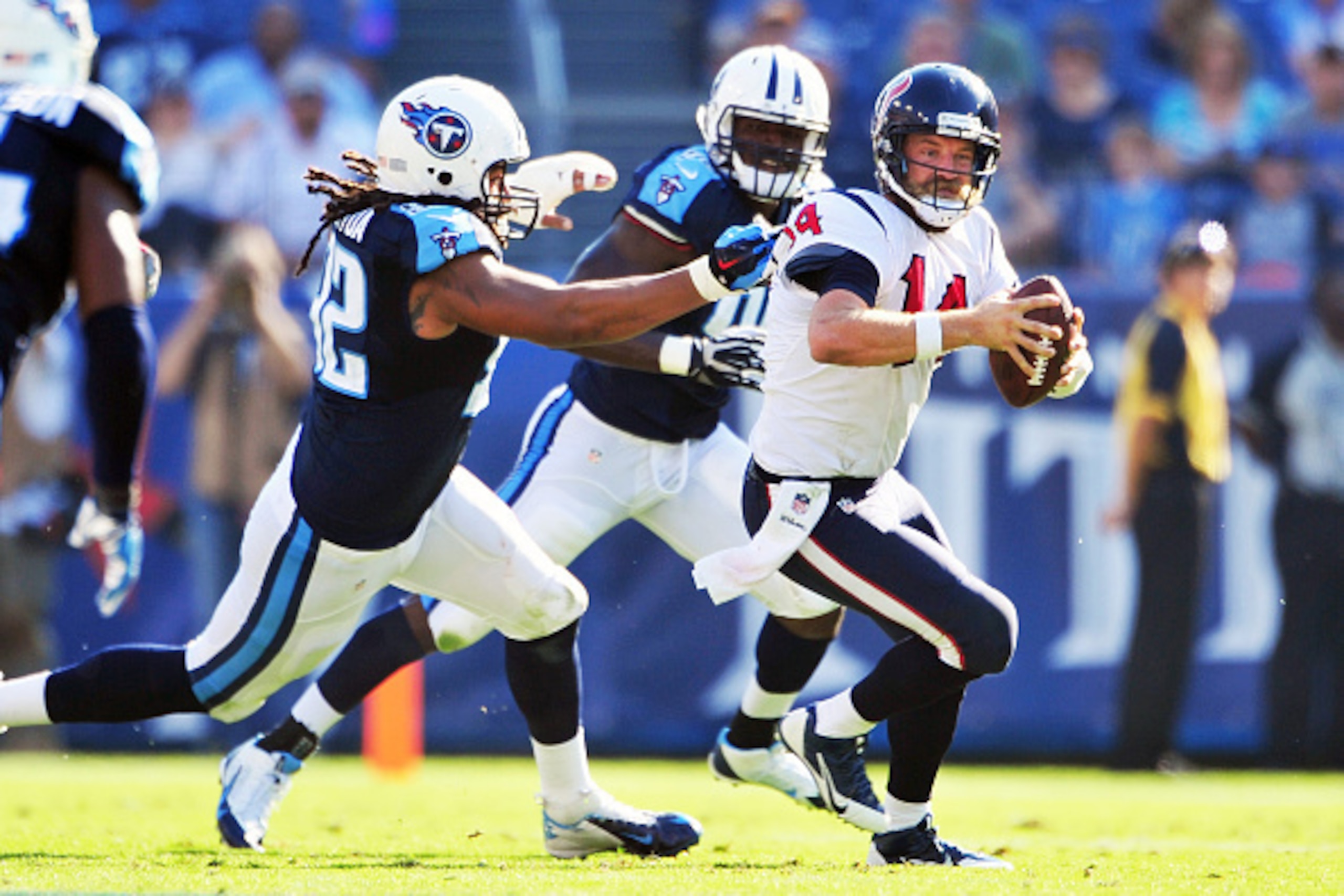 NASHVILLE, TN - OCTOBER 26:  Quarterback Ryan Fitzpatrick #14 of the Houston Texans scrambles as Ropati Pitoitua #92 of the Tennessee Titans chases during a NFL game at LP Field on October 26, 2014 in Nashville, Tennessee.  (Photo by Ronald C. Modra/Sport
