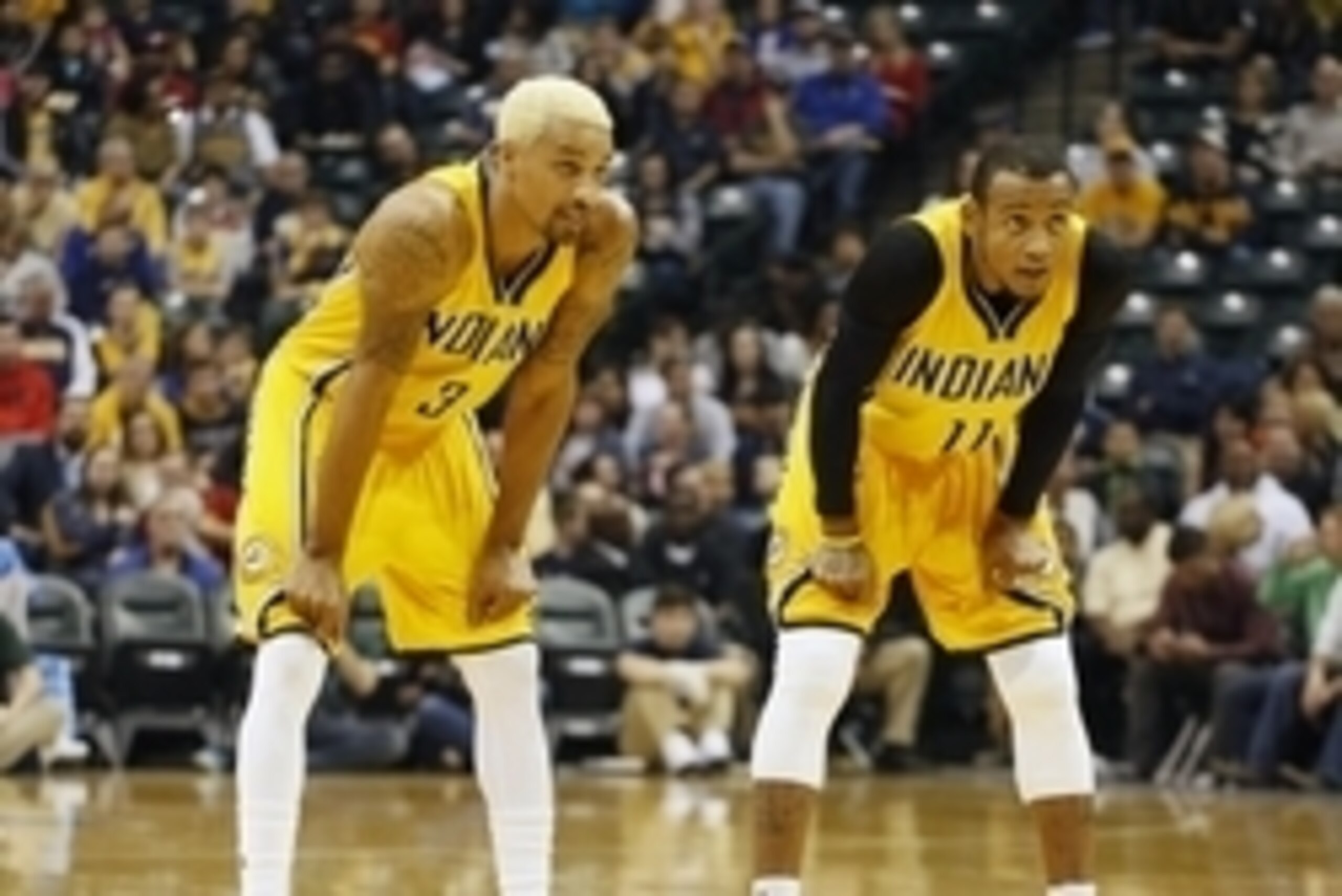 Dec 11, 2015; Indianapolis, IN, USA; Indiana Pacers guards Monta Ellis (11) and George Hill (3) watch the Pacers shoot free throws against the Miami Heat at Bankers Life Fieldhouse. Mandatory Credit: Brian Spurlock-USA TODAY Sports