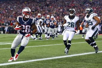 FOXBORO, MA - DECEMBER 06:  James White #28 of the New England Patriots runs after catching a touchdown pass during the second quarter against the Philadelphia Eagles at Gillette Stadium on December 6, 2015 in Foxboro, Massachusetts.  (Photo by Maddie Mey