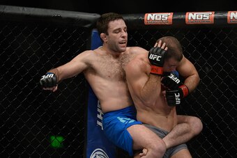 LAS VEGAS, NV - DECEMBER 11: Ryan Hall (left) punches Artem Lobov in their lightweight finals bout during the TUF Finale event inside The Chelsea at The Cosmopolitan of Las Vegas on December 11, 2015 in Las Vegas, Nevada.  (Photo by Brandon Magnus/Zuffa L