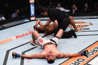 LAS VEGAS, NV - DECEMBER 11: Tony Ferguson (bottom) reacts to his victory over Edson Barboza in their lightweight bout during the TUF Finale event inside The Chelsea at The Cosmopolitan of Las Vegas on December 11, 2015 in Las Vegas, Nevada.  (Photo by Je