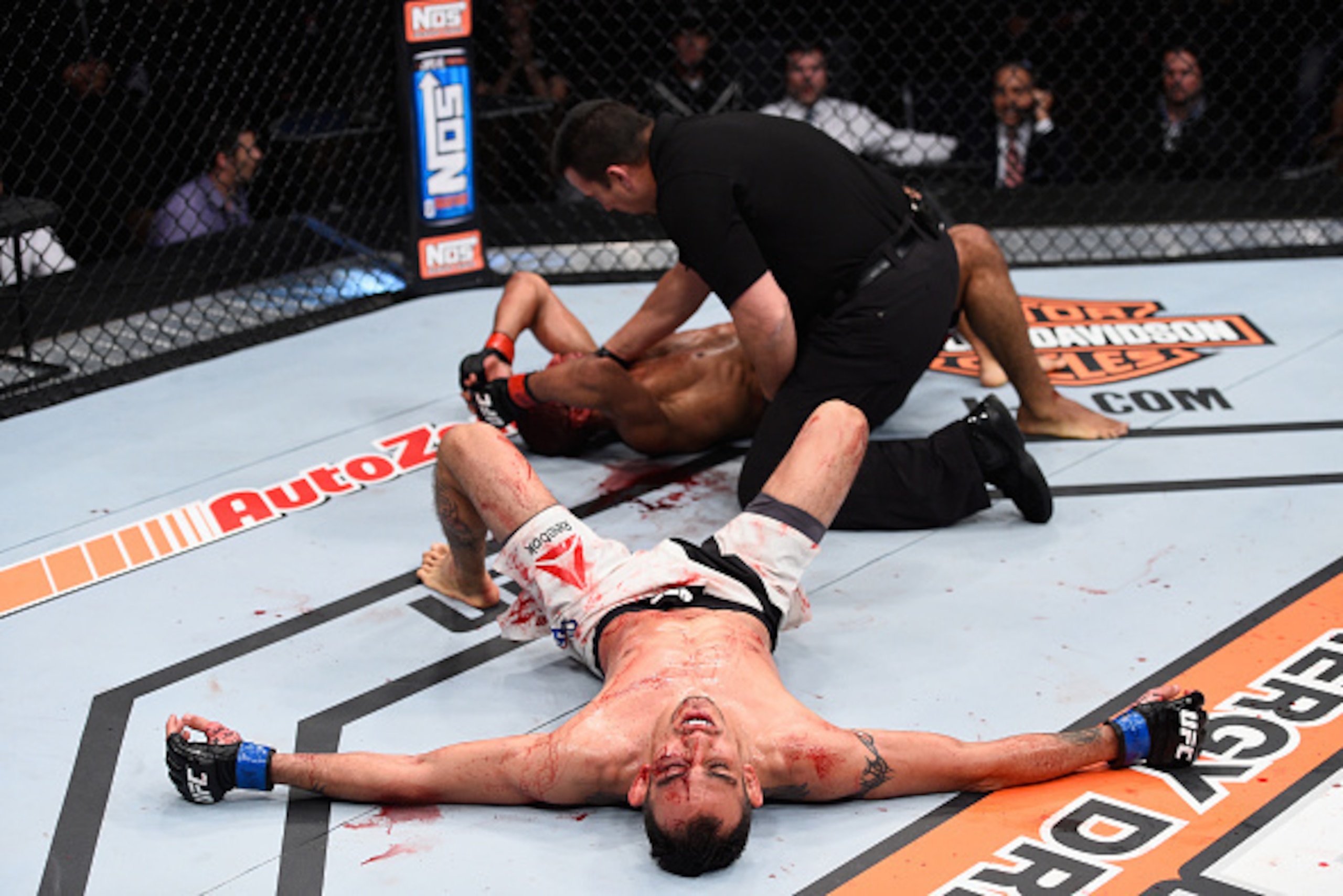 LAS VEGAS, NV - DECEMBER 11: Tony Ferguson (bottom) reacts to his victory over Edson Barboza in their lightweight bout during the TUF Finale event inside The Chelsea at The Cosmopolitan of Las Vegas on December 11, 2015 in Las Vegas, Nevada.  (Photo by Je