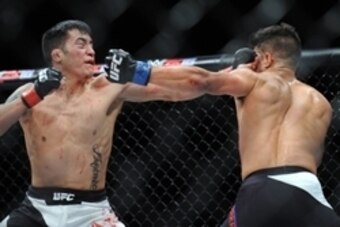 December 11, 2015; Las Vegas, NV, USA; Joby Sanchez lands a punch against Geane Herrera during The Ultimate Fighter Finale at The Chelsea at The Cosmopolitan. Mandatory Credit: Gary A. Vasquez-USA TODAY Sports