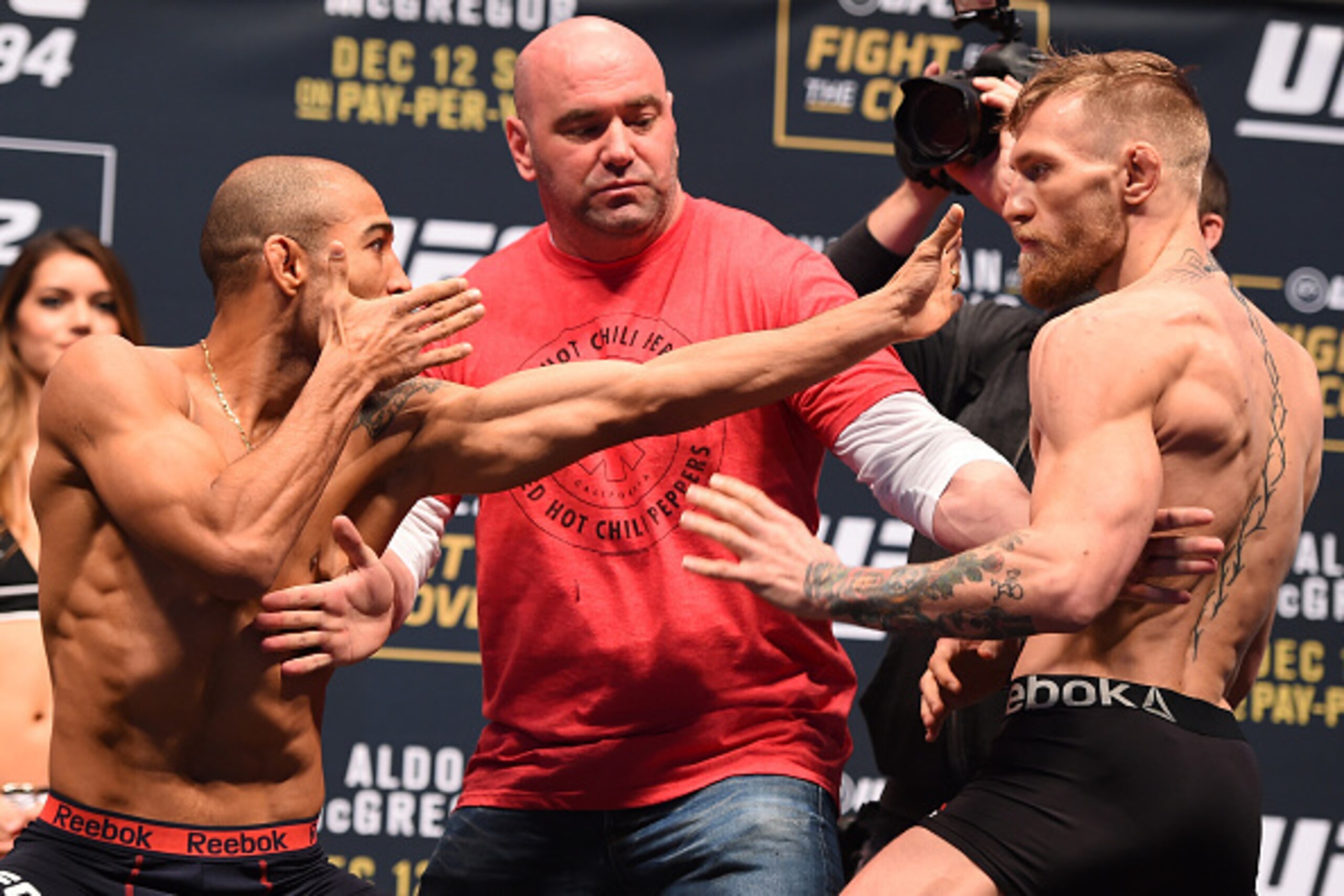 LAS VEGAS, NV - DECEMBER 11:  (L-R) UFC featherweight champion Jose Aldo of Brazil and interim UFC featherweight champion Conor McGregor of Ireland face off during the UFC 194 weigh-in inside MGM Grand Garden Arena on December 10, 2015 in Las Vegas, Nevad