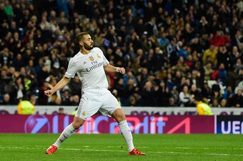Real Madrid's French forward Karim Benzema celebrates his third goal during the UEFA Champions League Group A football match Real Madrid CF vs Malmo FF at the Santiago Bernabeu stadium in Madrid on December 8, 2015.   AFP PHOTO/ PIERRE-PHILIPPE MARCOU / A