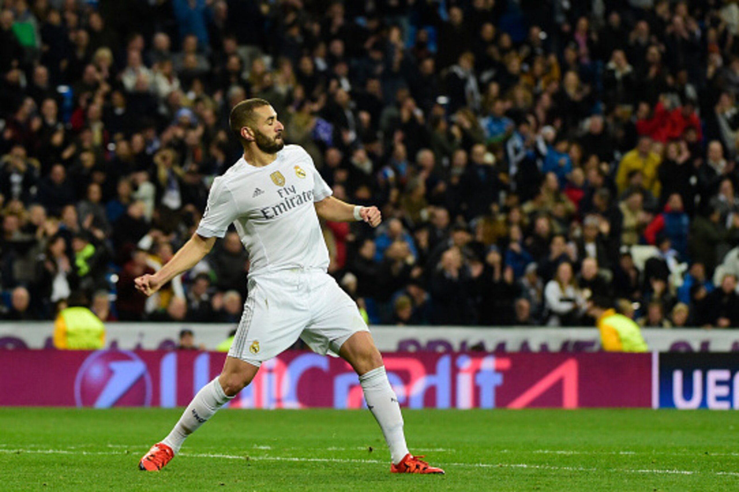Real Madrid's French forward Karim Benzema celebrates his third goal during the UEFA Champions League Group A football match Real Madrid CF vs Malmo FF at the Santiago Bernabeu stadium in Madrid on December 8, 2015.   AFP PHOTO/ PIERRE-PHILIPPE MARCOU / A