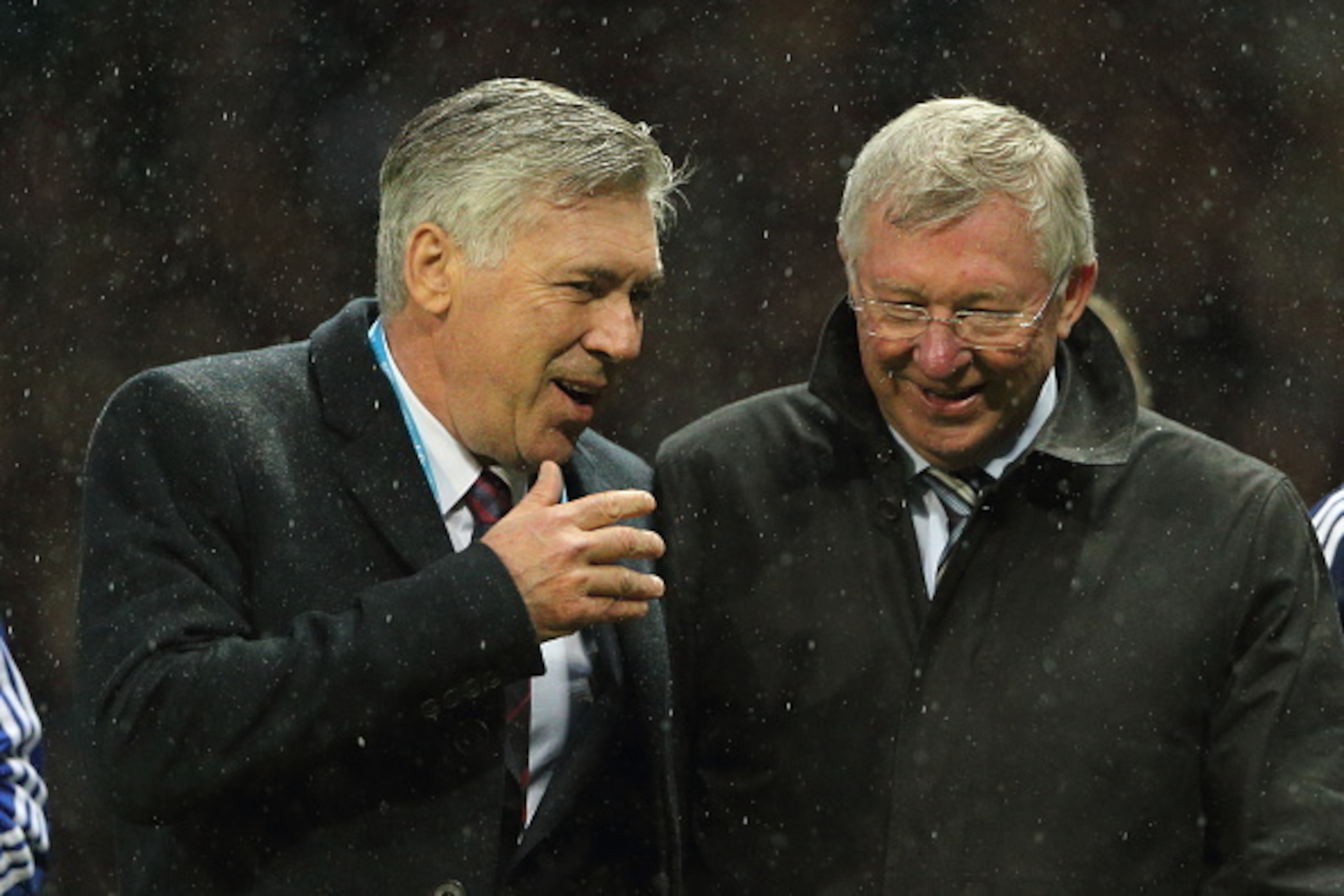 MANCHESTER, ENGLAND - NOVEMBER 14: Carlo Ancelotti the head coach / manager of Rest of the World XI and Sir Alex Ferguson the head coach / manager of Great Britain and Ireland XI during the David Beckham Match for Children in aid of UNICEF at Old Trafford