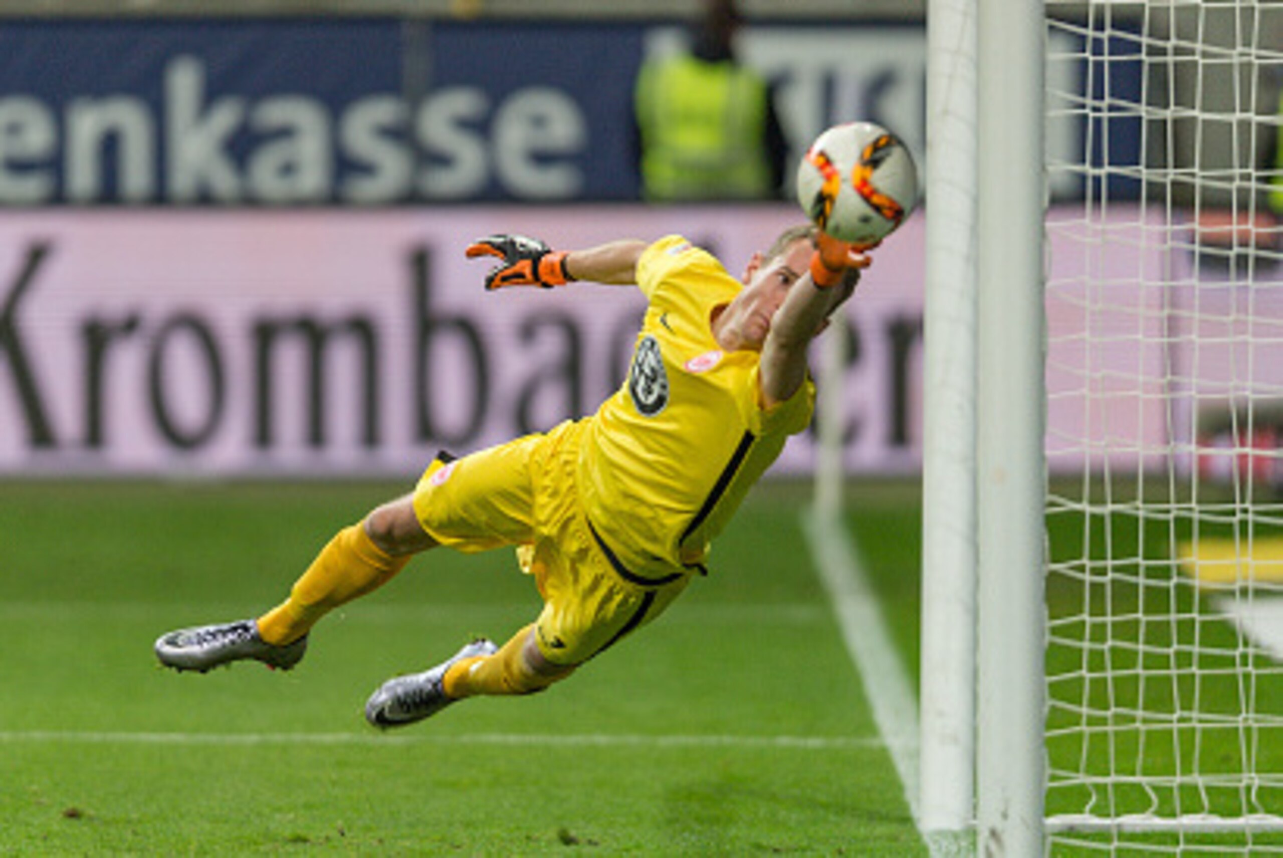 FRANKFURT AM MAIN, GERMANY - DECEMBER 06: Goalkeeper Lukas Hradecky (#1) of Eintracht Frankfurt fails to save the first goal of SV Darmstadt 98 scored by Aytac Sulu (4) of SV Darmstadt 98 (not pictured) at Commerzbank-Arena on December 06, 2015 in Frankfu