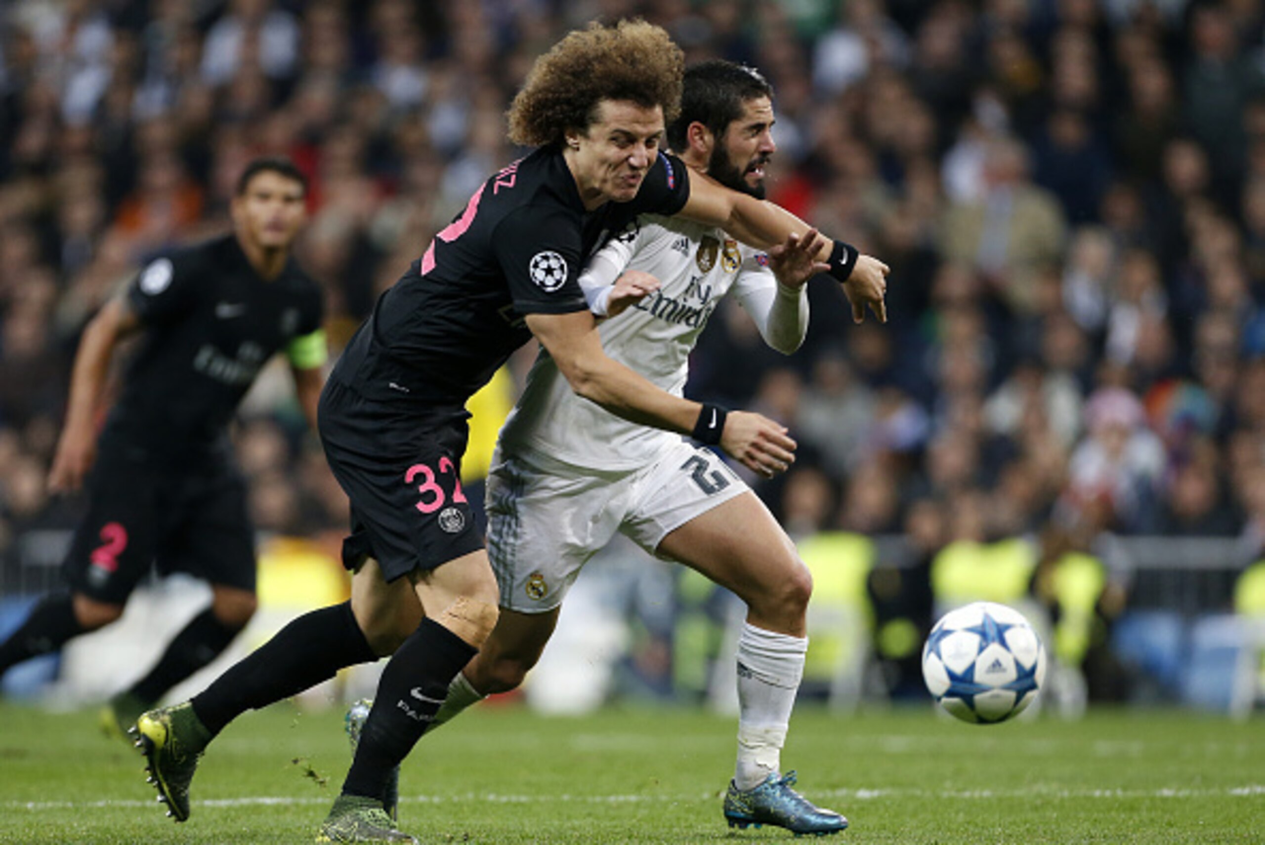 MADRID, SPAIN - NOVEMBER 3: David Luiz of PSG and Isco of Real Madrid in action during the UEFA Champions League match between Real Madrid and Paris Saint-Germain (PSG) at Santiago Bernabeu stadium on November 3, 2015 in Madrid, Spain. (Photo by Jean Catu