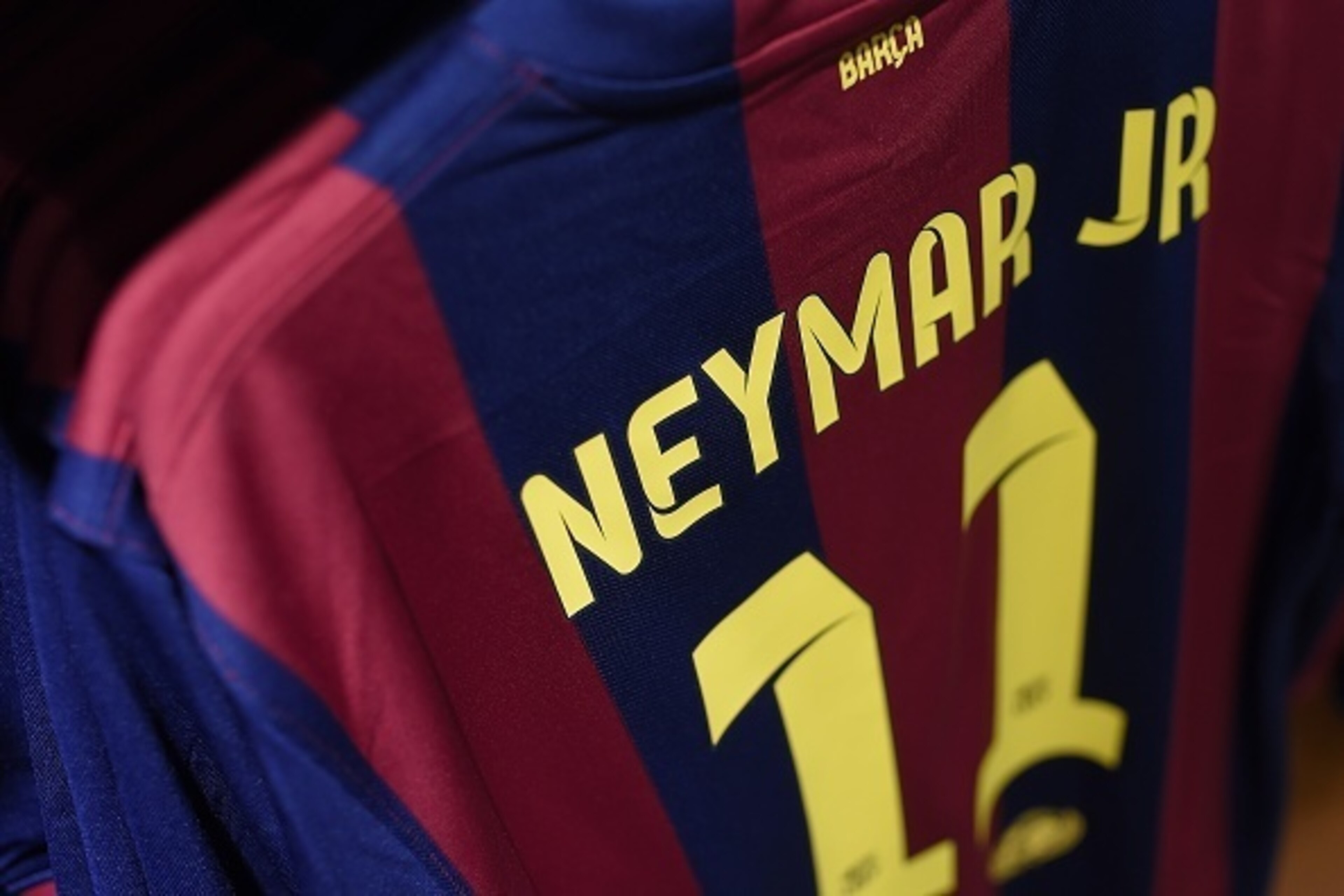 Picture shows a football  jersey with the name of Barcelona's Brazilian forward Neymar da Silva Santos Junior at the FC Barcelona's store at the Camp Nou stadium in Barcelona on March 13, 2015. A Spanish judge today upheld a tax fraud case against FC Barc