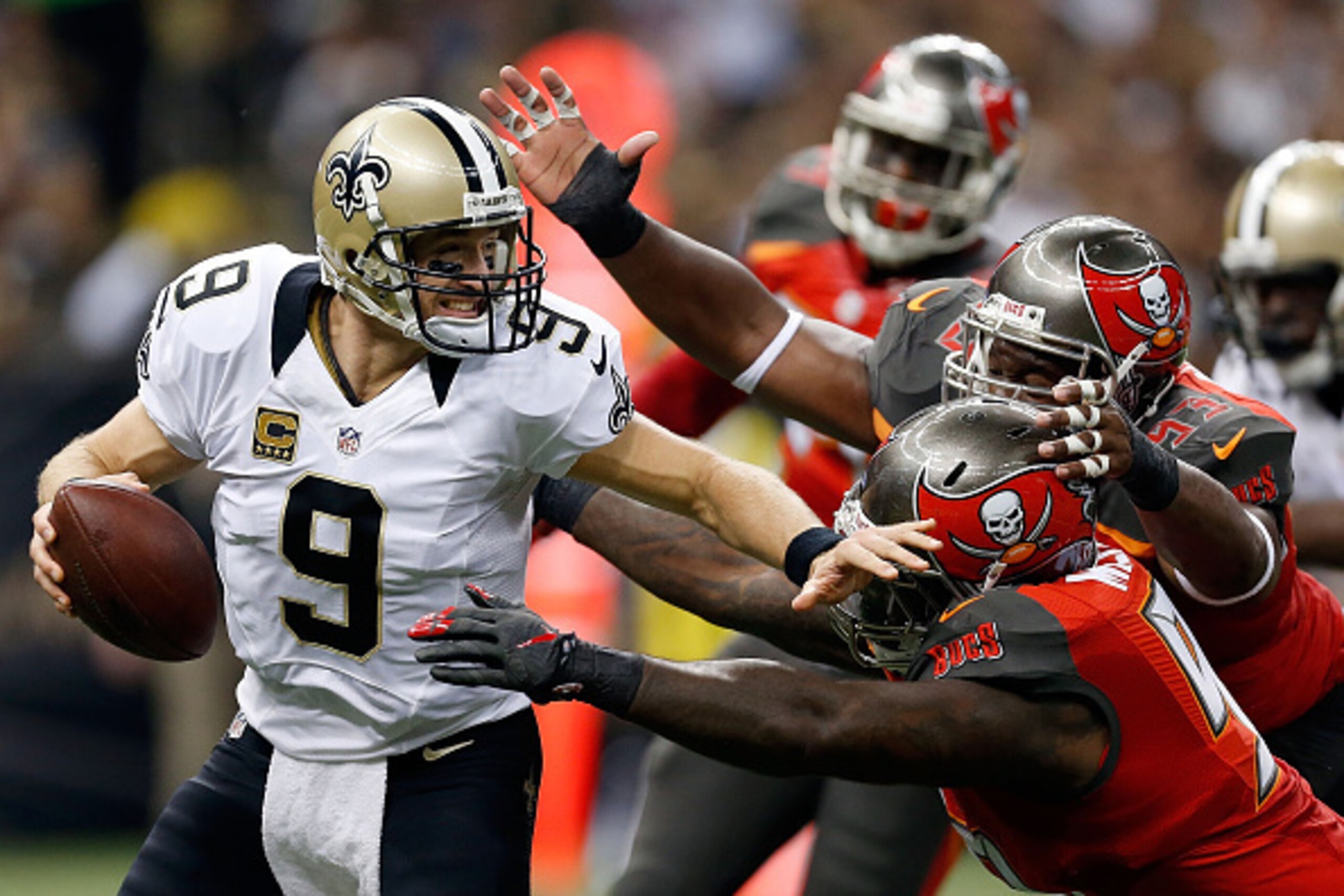 NEW ORLEANS, LA - SEPTEMBER 20:  Drew Brees #9 of the New Orleans Saints is sacked by Gerald McCoy #93 of the Tampa Bay Buccaneers during the first quarter of a game at the Mercedes-Benz Superdome on September 20, 2015 in New Orleans, Louisiana.  (Photo b