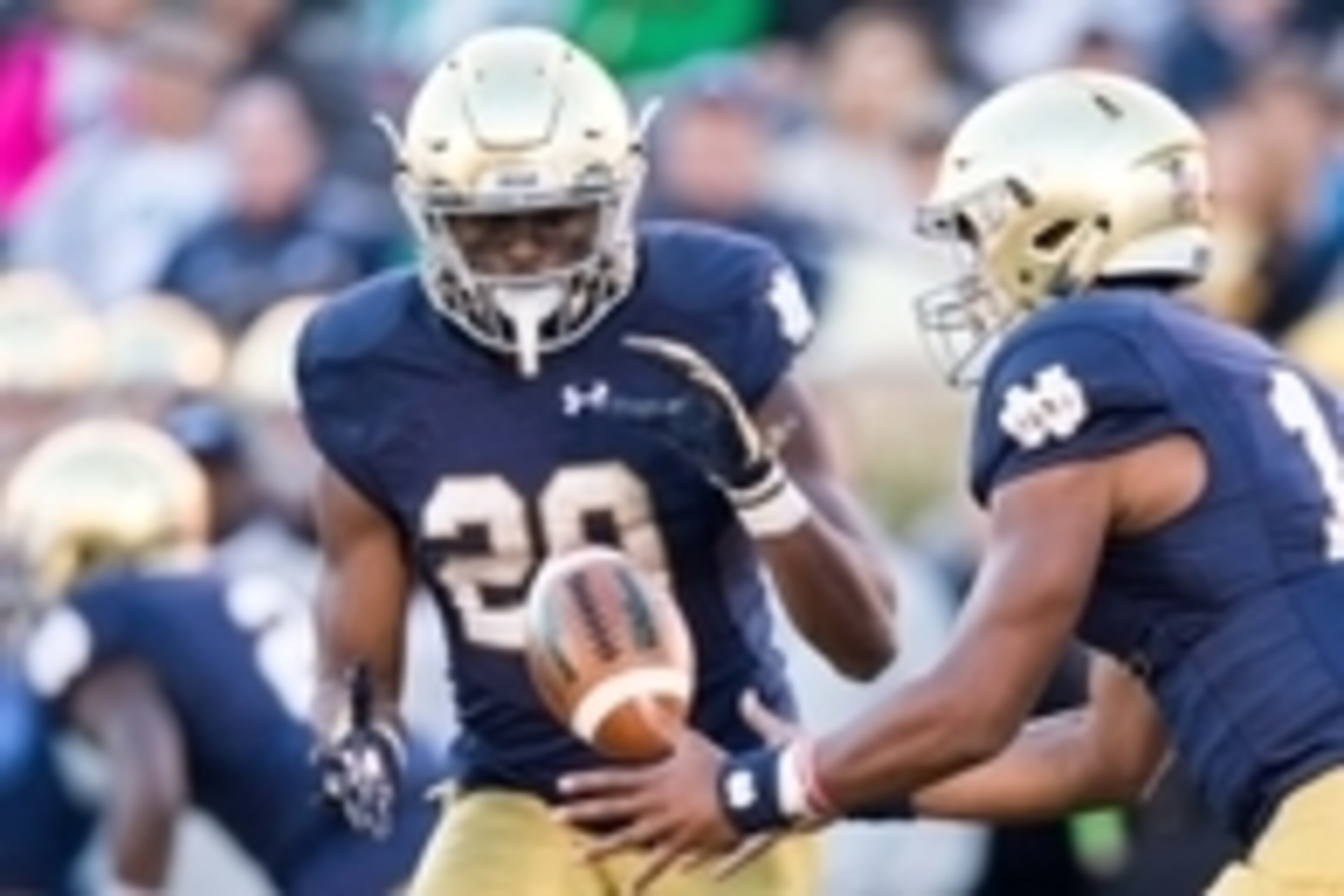 Oct 10, 2015; South Bend, IN, USA; Notre Dame Fighting Irish quarterback DeShone Kizer (14) pitches the ball to running back C.J. Prosise (20) in the third quarter against the Navy Midshipmen at Notre Dame Stadium. Notre Dame won 41-24. Mandatory Credit: 