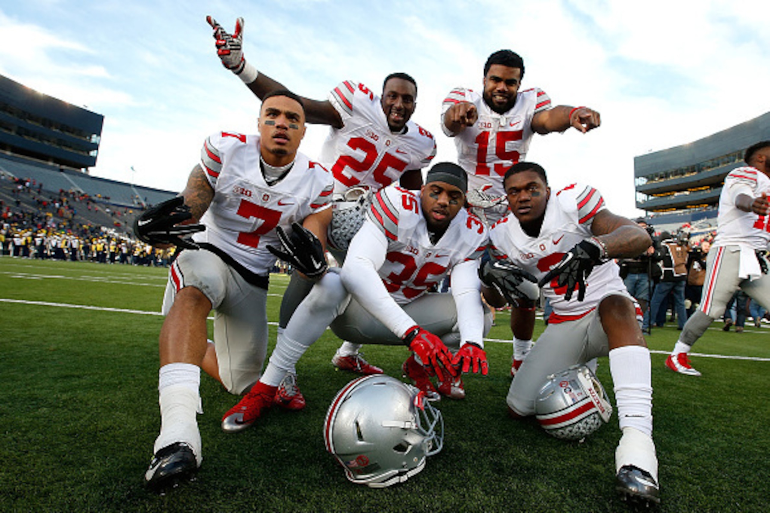ANN ARBOR, MI - NOVEMBER 28: Ezekiel Elliott #15, Bri'onte Dunn #25, Jalin Marshall #7, Chris Worley #35 and Dontre Wilson #2 of the Ohio State Buckeyes celebrate a 42-13 win over the Michigan Wolverines at Michigan Stadium on November 28, 2015 in Ann Ar ANN ARBOR, MI - NOVEMBER 28: Ezekiel Elliott #15, Bri'onte Dunn #25, Jalin Marshall #7, Chris Worley #35 and Dontre Wilson #2 of the Ohio State Buckeyes celebrate a 42-13 win over the Michigan Wolverines at Michigan Stadium on November 28, 2015 in Ann Ar