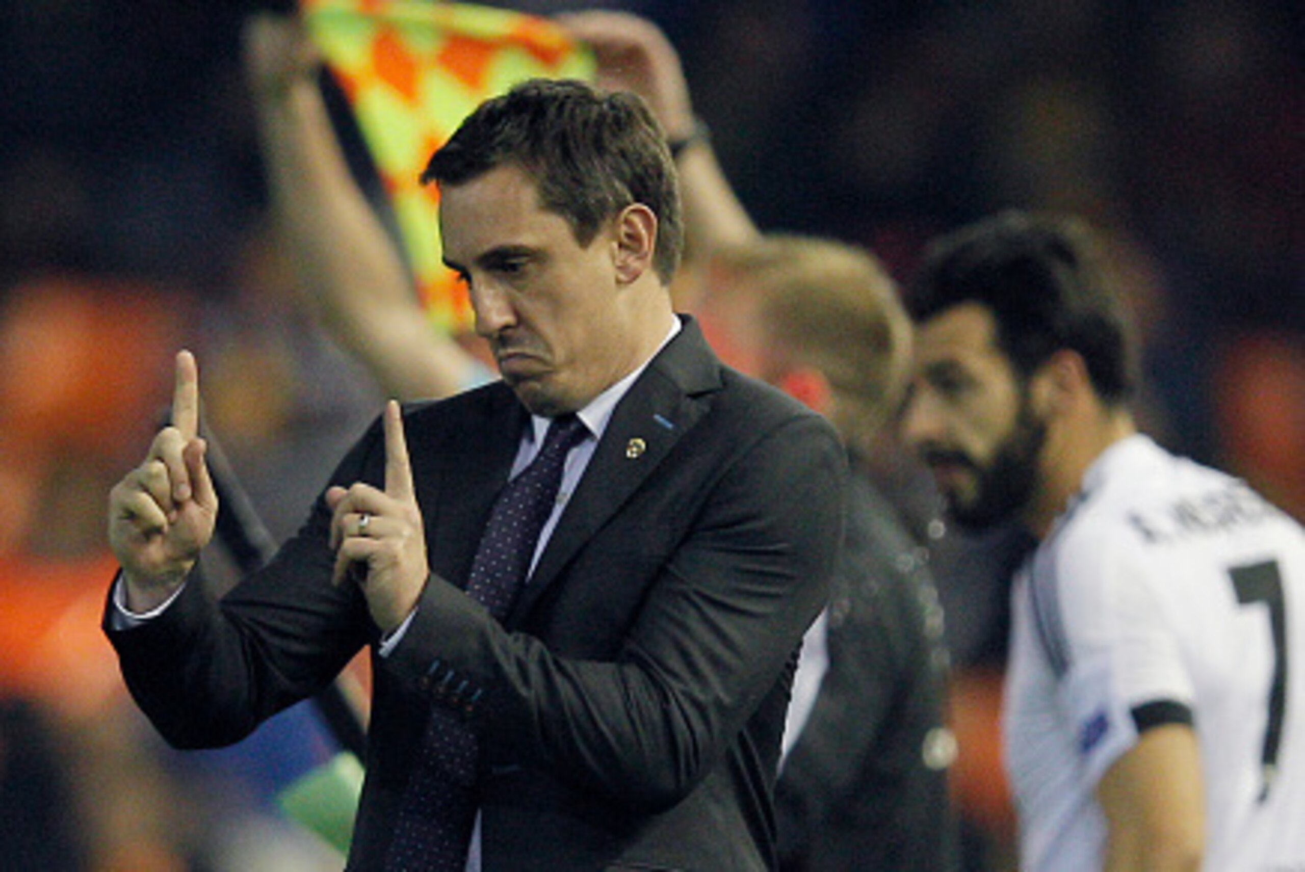 Valencia's British coach Gary Neville gestures from the sidelines during the UEFA Champions League football match Valencia CF vs Olympique Lyonnais at the Mestalla stadium in Valencia on December 9, 2015.   AFP PHOTO/ JOSE JORDAN / AFP / JOSE JORDAN      