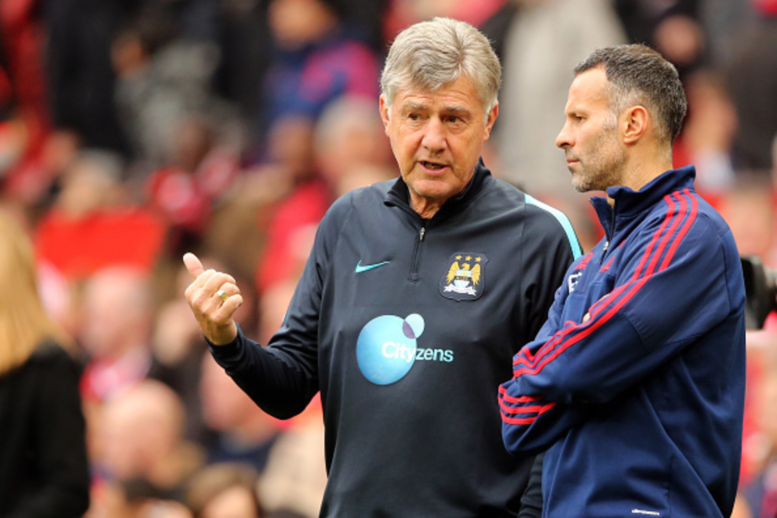 MANCHESTER, ENGLAND - OCTOBER 25:  Brian Kidd joint assistant manager of Manchester City and Ryan Giggs assistant manager of Manchester United prior to the Barclays Premier League match between Manchester United and Manchester City at Old Trafford on Octo