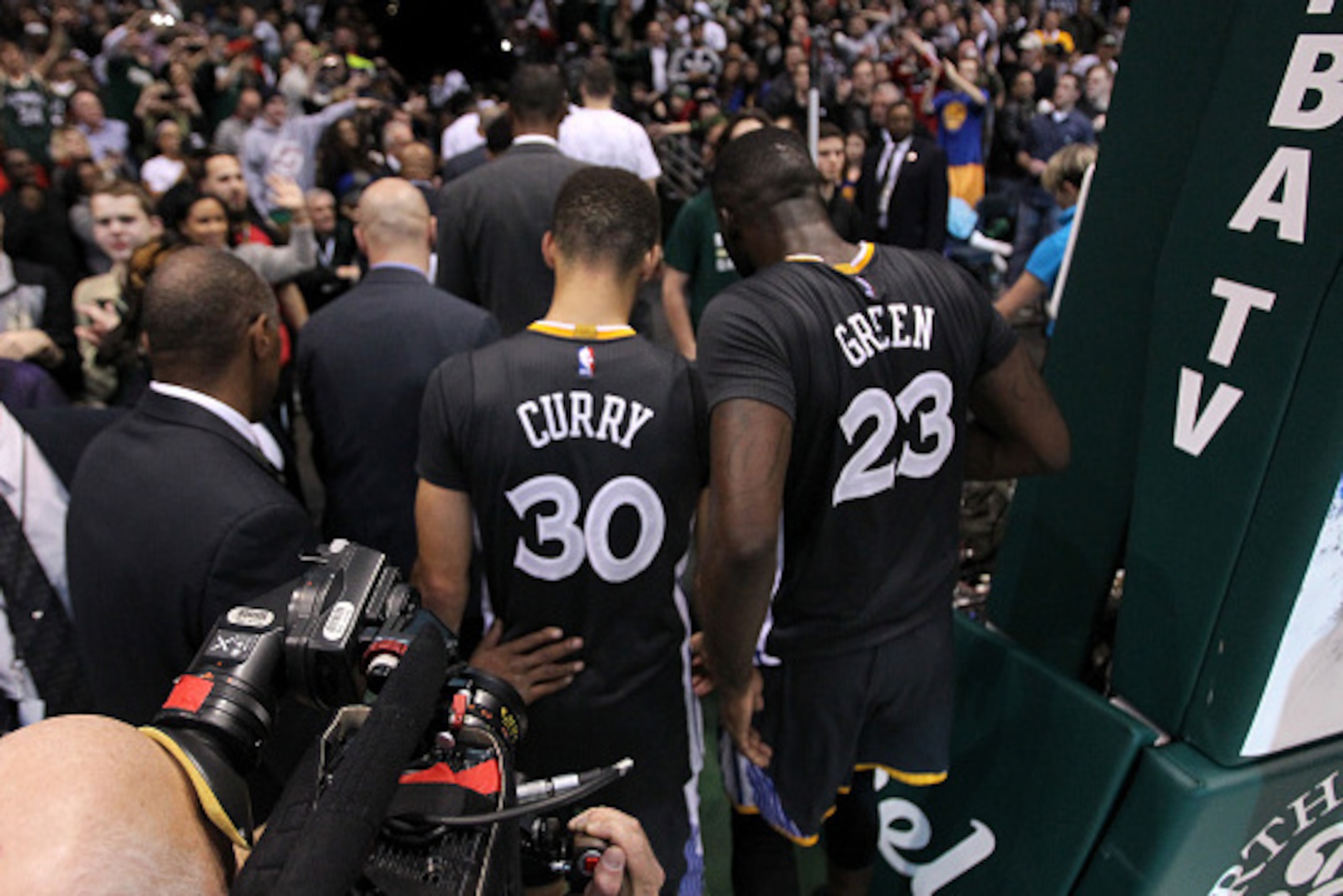 MILWAUKEE, WI - DECEMBER 12: Stephen Curry #30 of the Golden State Warriors and Draymond Green #23 walk off the court after the 95-108 loss to the Milwaukee Bucks at BMO Harris Bradley Center on December 12, 2015 in Milwaukee, Wisconsin. NOTE TO USER: Use