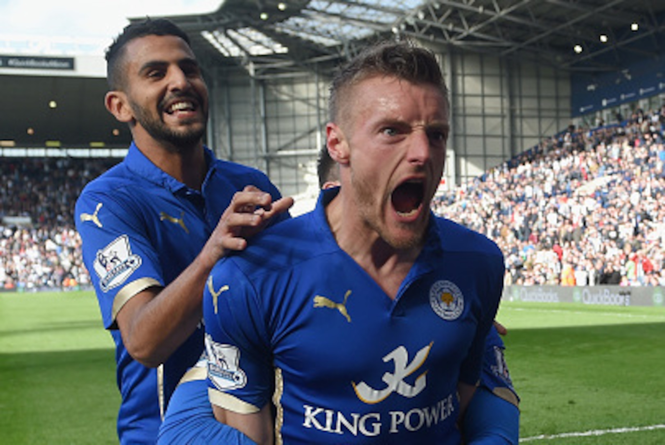 WEST BROMWICH, ENGLAND - APRIL 11:  Jamie Vardy of Leicester City (R) with Riyad Mahrez of Leicester City (L) celebrates scoring the third goal with team mates during the Barclays Premier League match between West Bromwich Albion and Leicester City at The