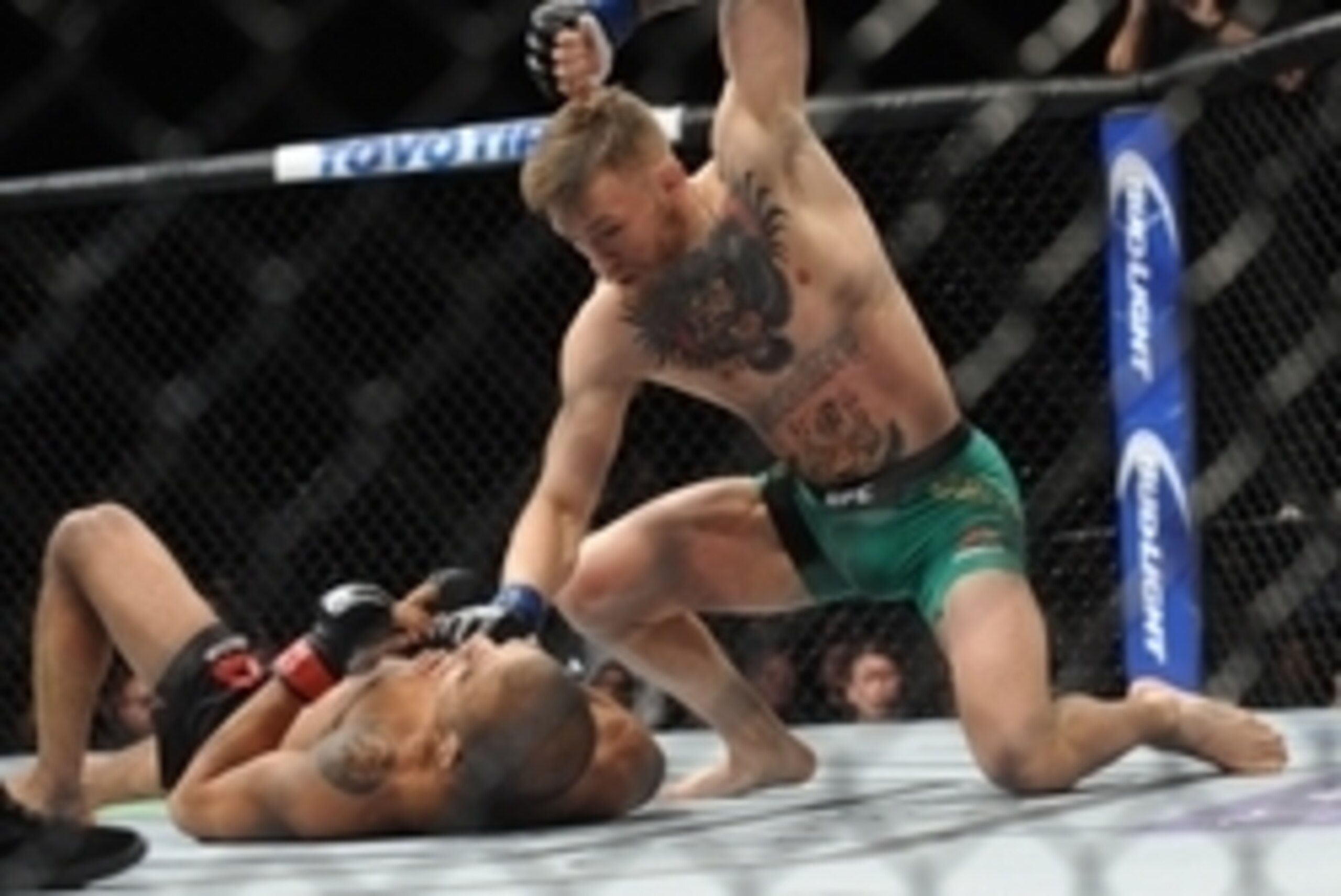December 12, 2015; Las Vegas, NV, USA; Conor McGregor lands punches to win via technical knockout  against Jose Aldo during UFC 194 at MGM Grand Garden Arena. Mandatory Credit: Gary A. Vasquez-USA TODAY Sports