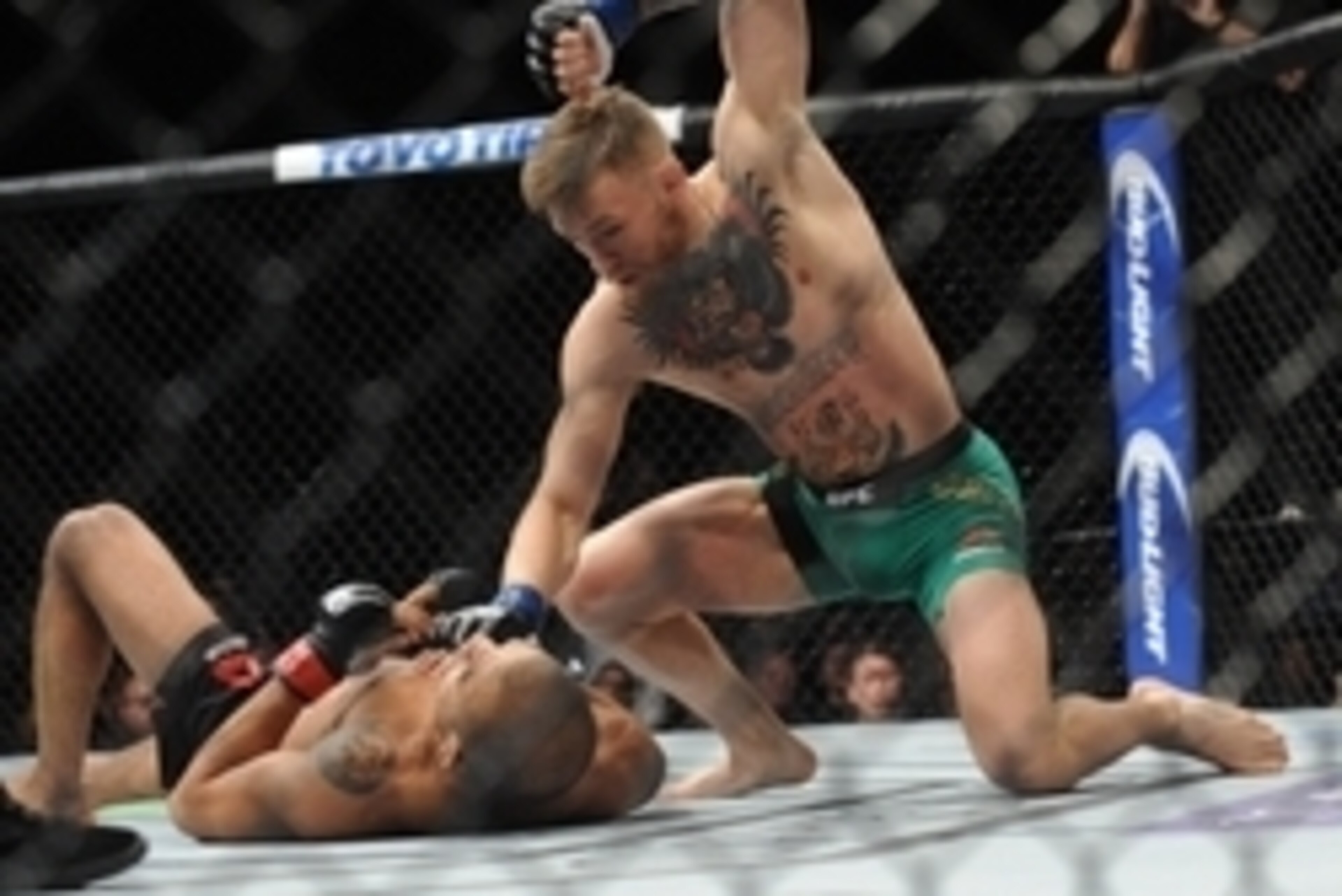 December 12, 2015; Las Vegas, NV, USA; Conor McGregor lands punches to win via technical knockout  against Jose Aldo during UFC 194 at MGM Grand Garden Arena. Mandatory Credit: Gary A. Vasquez-USA TODAY Sports