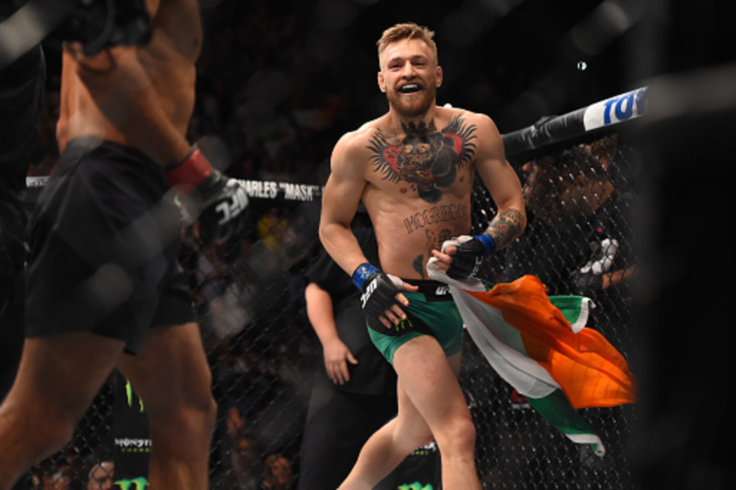 LAS VEGAS, NEVADA - DECEMBER 12: Conor McGregor of Ireland celebrates after defeating Jose Aldo of Brazil in their featherweight championship bout during the UFC 194 event inside MGM Grand Garden Arena on December 12, 2015 in Las Vegas, Nevada. (Photo b LAS VEGAS, NEVADA - DECEMBER 12: Conor McGregor of Ireland celebrates after defeating Jose Aldo of Brazil in their featherweight championship bout during the UFC 194 event inside MGM Grand Garden Arena on December 12, 2015 in Las Vegas, Nevada. (Photo b