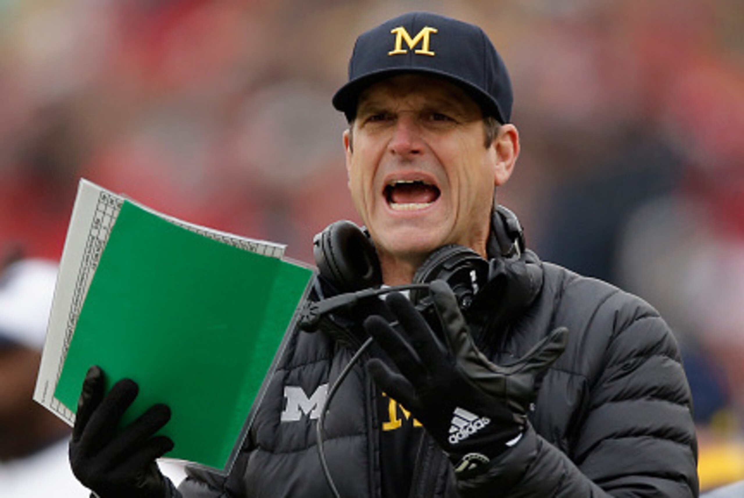 ANN ARBOR, MI - NOVEMBER 28:  Head coach Jim Harbaugh of the Michigan Wolverines looks on from the sideline in the first half against the Ohio State Buckeyes at Michigan Stadium on November 28, 2015 in Ann Arbor, Michigan.  (Photo by Gregory Shamus/Getty 