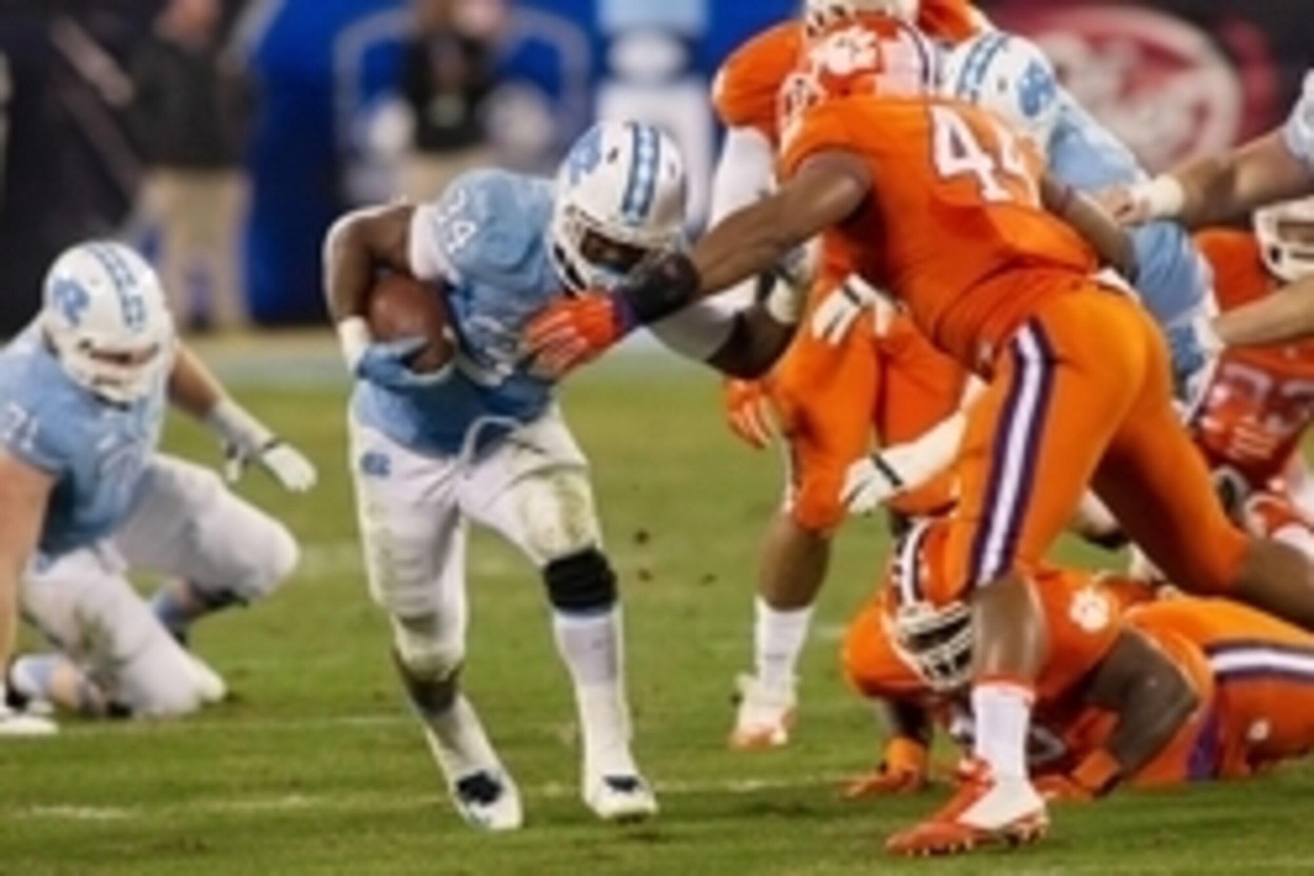 Dec 5, 2015; Charlotte, NC, USA; North Carolina Tar Heels running back Elijah Hood (34) carries the ball during the third quarter against the Clemson Tigers in the ACC football championship game at Bank of America Stadium. Mandatory Credit: Jeremy Brevard