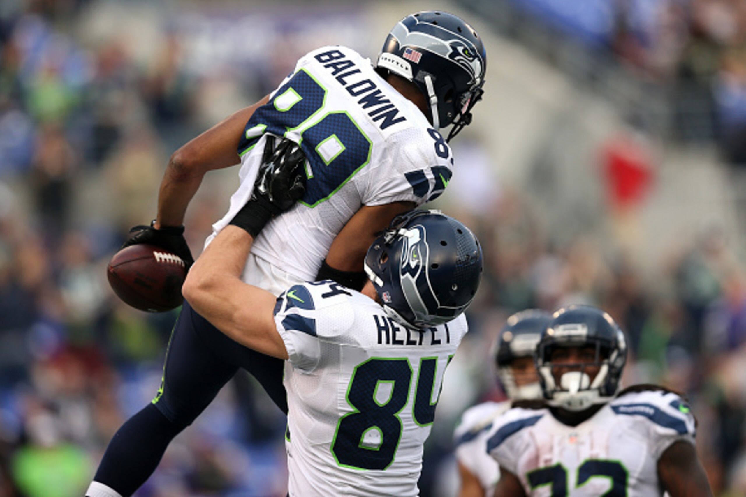 BALTIMORE, MD - DECEMBER 13: Wide receiver Doug Baldwin #89 of the Seattle Seahawks celebrates with teammate tight end Cooper Helfet #84 after scoring a fourth quarter touchdown against the Baltimore Ravens at M&T Bank Stadium on December 13, 2015 in Balt