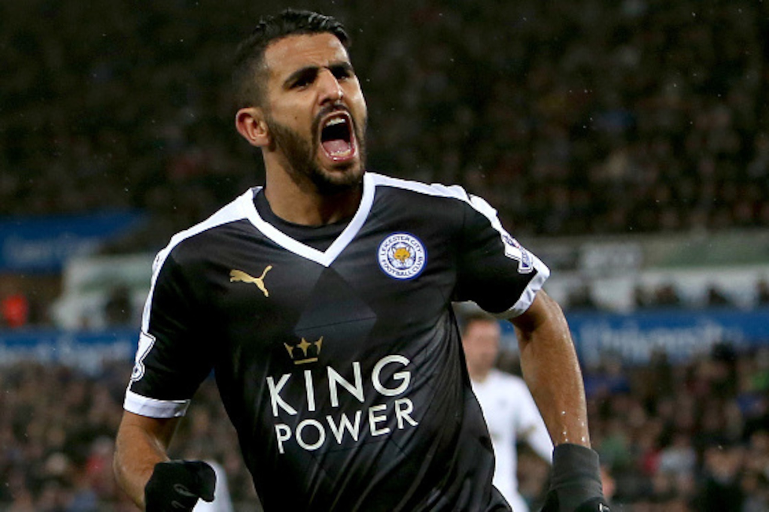Leicester City's Algerian midfielder Riyad Mahrez celebrates after scoring his third goal during the English Premier League football match between Swansea City and Leicester City at The Liberty Stadium in Swansea, south Wales on December 5, 2015.       AF