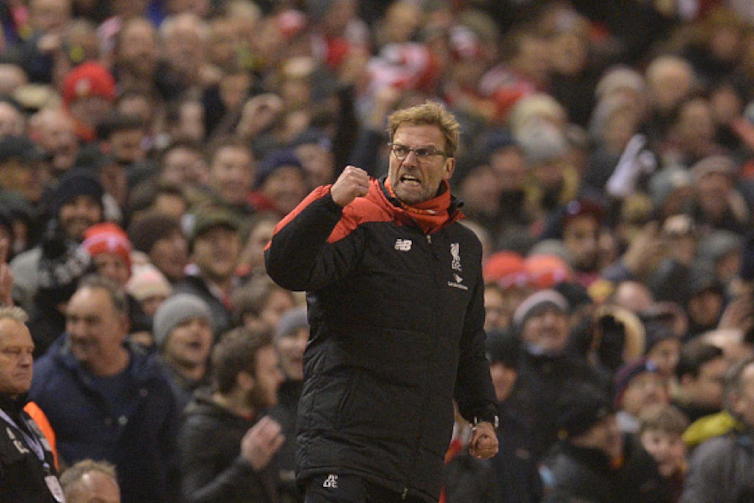 Liverpool's German manager Jurgen Klopp celebrates their late equalising goal to level the score at 2-2 the English Premier League football match between Liverpool and West Bromwich Albion at Anfield in Liverpool, northwest England, on December 13, 2015. 