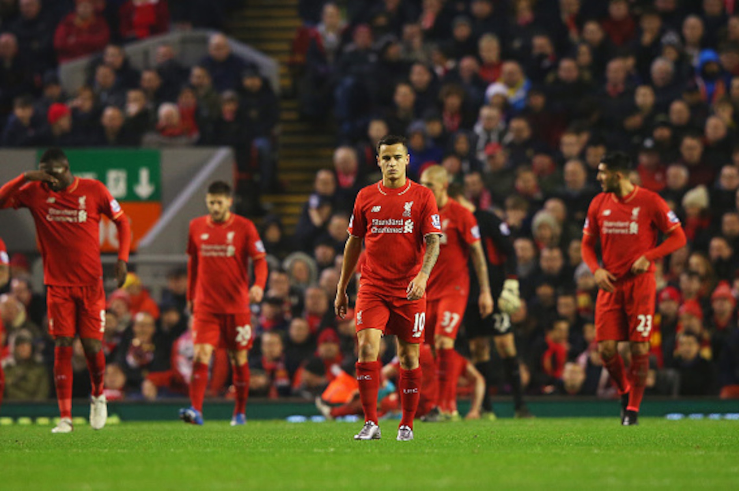 LIVERPOOL, ENGLAND - DECEMBER 13:  Philippe Coutinho of Liverpool (10) looks dejected alongside team mates as Craig Dawson of West Bromwich Albion scores their first and equalising goal during the Barclays Premier League match between Liverpool and West B