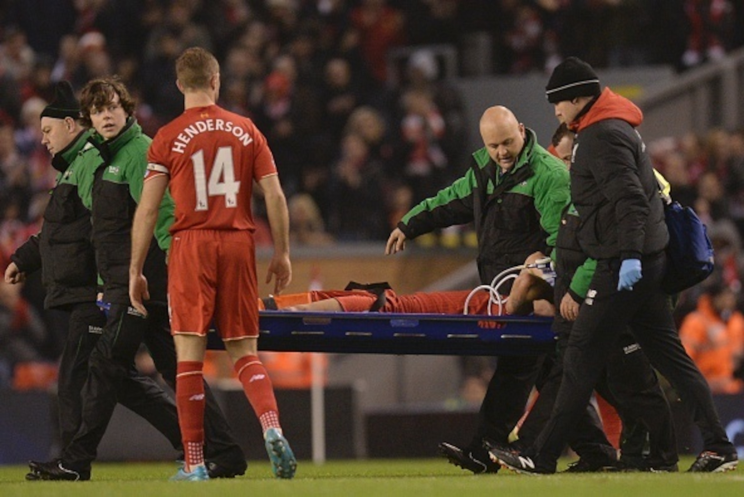 Liverpool's Croatian defender Dejan Lovren (C) is stretchered off after being injured in a challenge with West Bromwich Albion's English midfielder Craig Gardner during the English Premier League football match between Liverpool and West Bromwich Albion a