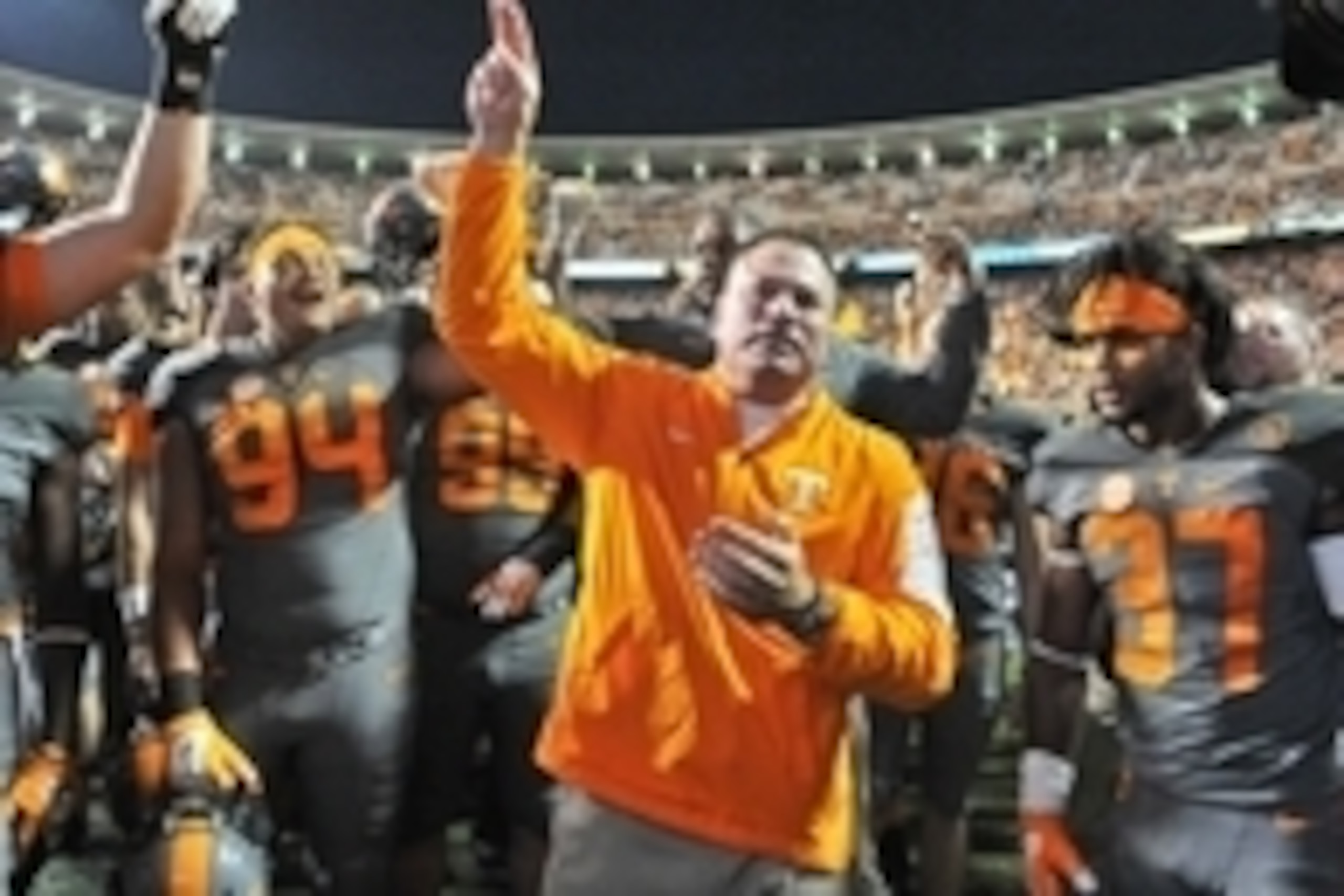 Oct 10, 2015; Knoxville, TN, USA; Tennessee Volunteers head coach Butch Jones waves to fans as he celebrates with his team after defeating the Georgia Bulldogs during the second half at Neyland Stadium. Tennessee won 38-31. Mandatory Credit: Jim Brown-USA
