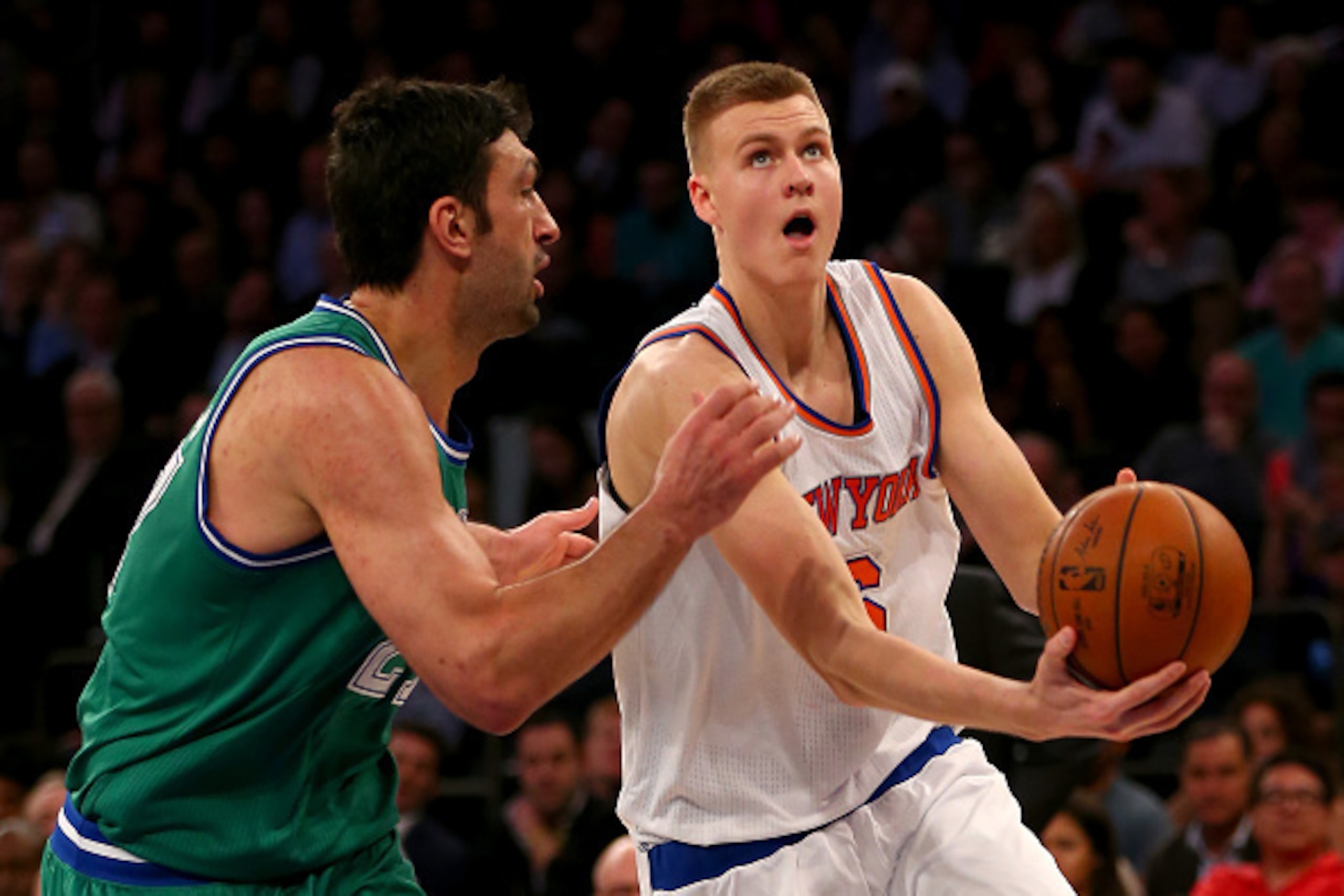 NEW YORK, NY - DECEMBER 07:  Kristaps Porzingis #6 of the New York Knicks heads for the net as Zaza Pachulia #27 of the Dallas Mavericks defends at Madison Square Garden on December 7, 2015 in New York City.The Dallas Mavericks defeated the New York Knick