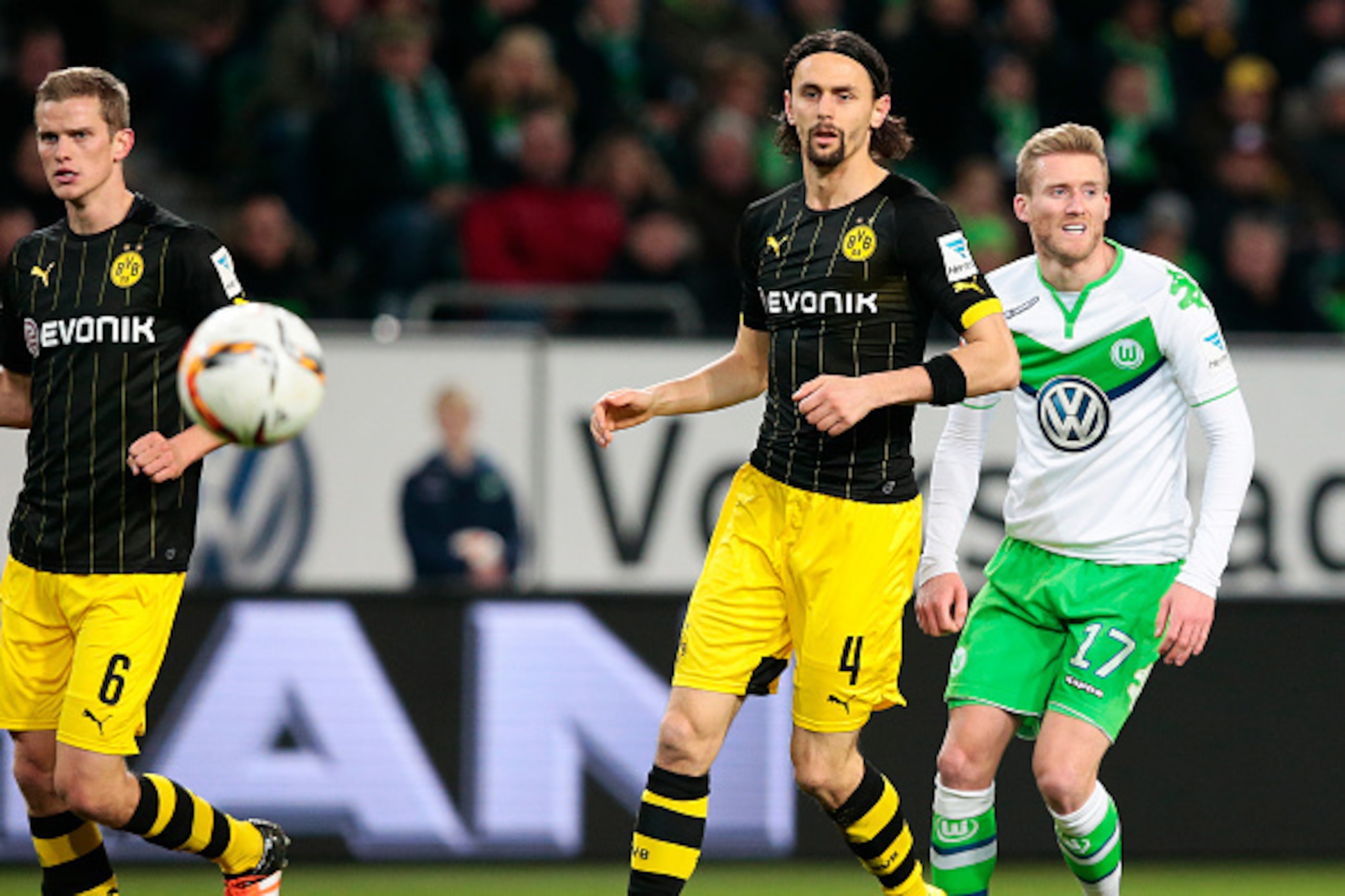 WOLFSBURG, GERMANY - DECEMBER 05: Andre Schuerrle (R) of Wolfsburg and Neven Subotic (L) of Dortmund compete for the ball during the First Bundesliga match at between VfL Wolfsburg and Borussia Dortmund at Volkswagen Arena on December 5, 2015 in Wolfsburg