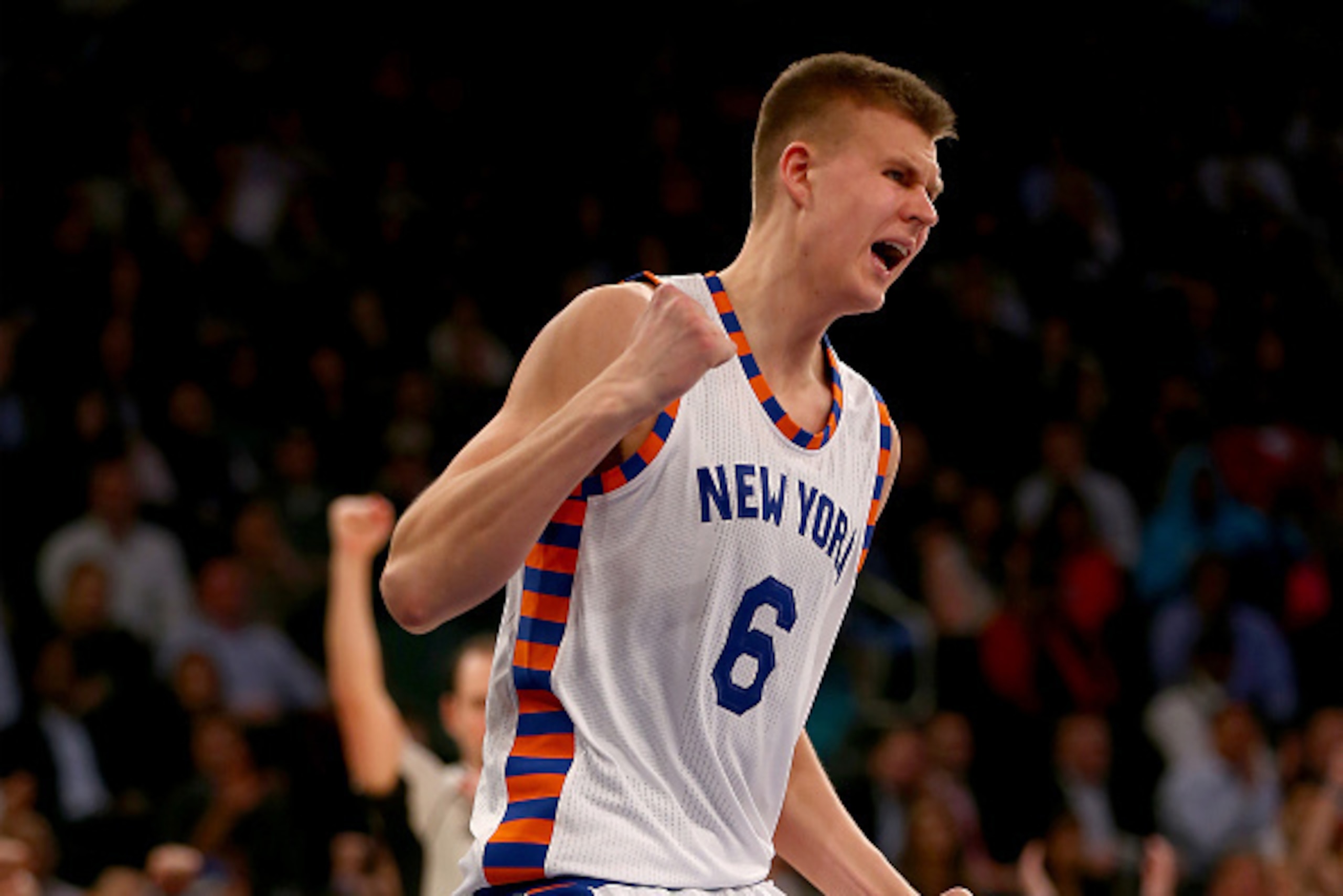 NEW YORK, NY - NOVEMBER 17:  Kristaps Porzingis #6 of the New York Knicks celebrates after drawing the foul in the fourth quarter against the Charlotte Hornets at Madison Square Garden on November 17, 2015 in New York City.NOTE TO USER: User expressly ack