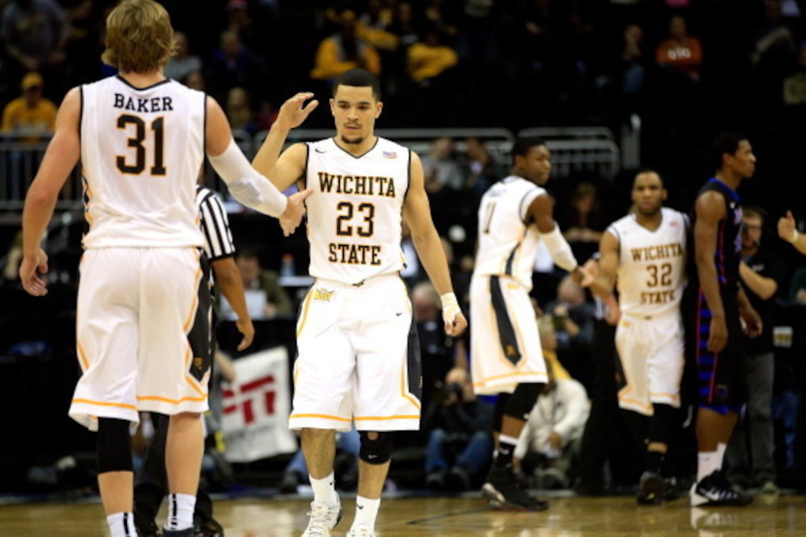 KANSAS CITY, MO - NOVEMBER 25:  Fred VanVleet #23 of the Wichita State Shockers is congratulated by Ron Baker #31 after scoring during the CBE Hall Of Fame Classic game against the DePaul Blue Demons at the Sprint Center on November 25, 2013 in Kansas Cit
