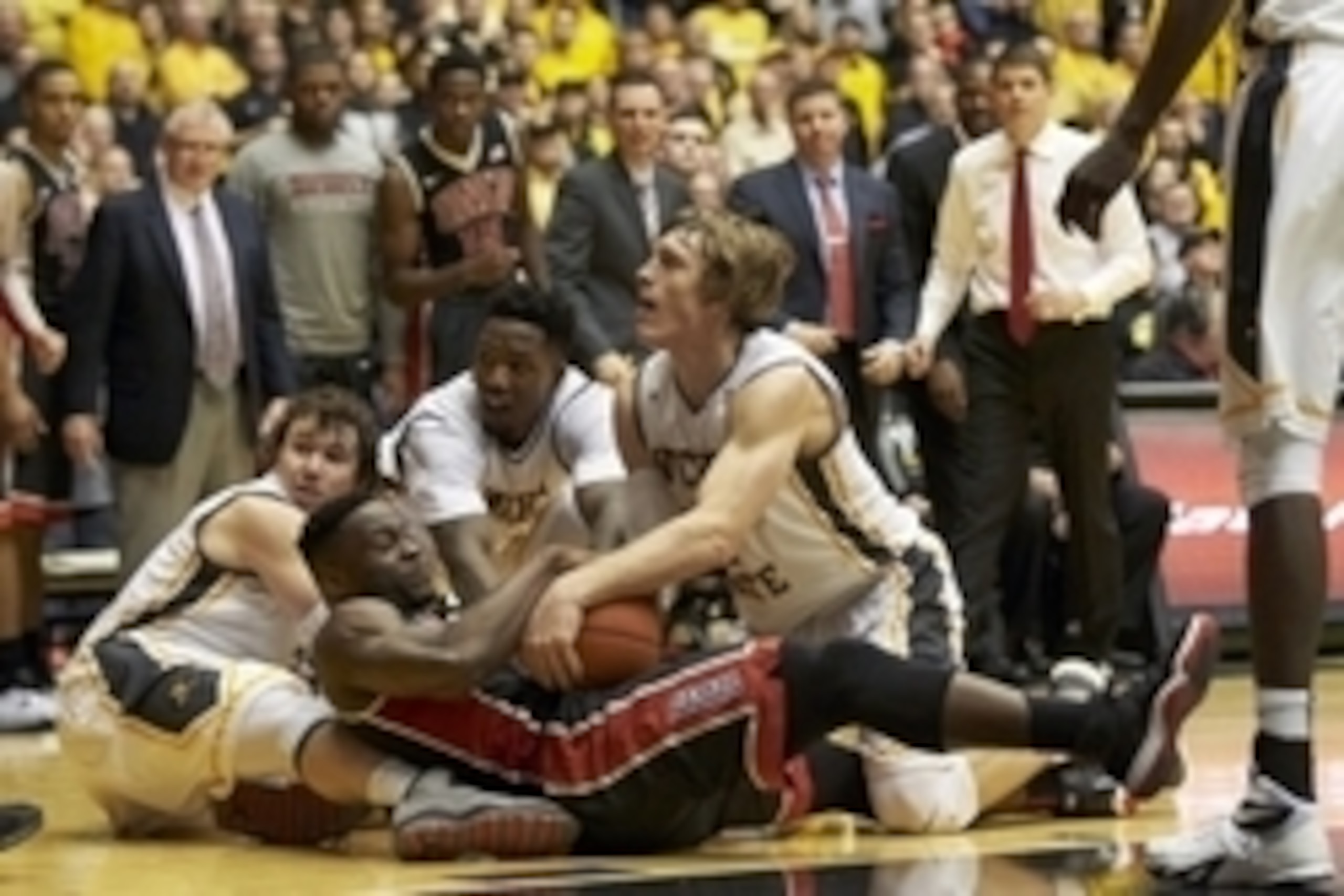 Dec 9, 2015; Wichita, KS, USA; Wichita State Shockers guard Evan Wessel (3), UNLV Rebels guard Ike Nwamu (0) Wichita State Shockers forward Zach Brown (1) and Wichita State Shockers guard Ron Baker (31) fight for control of the ball at Charles Koch Arena.