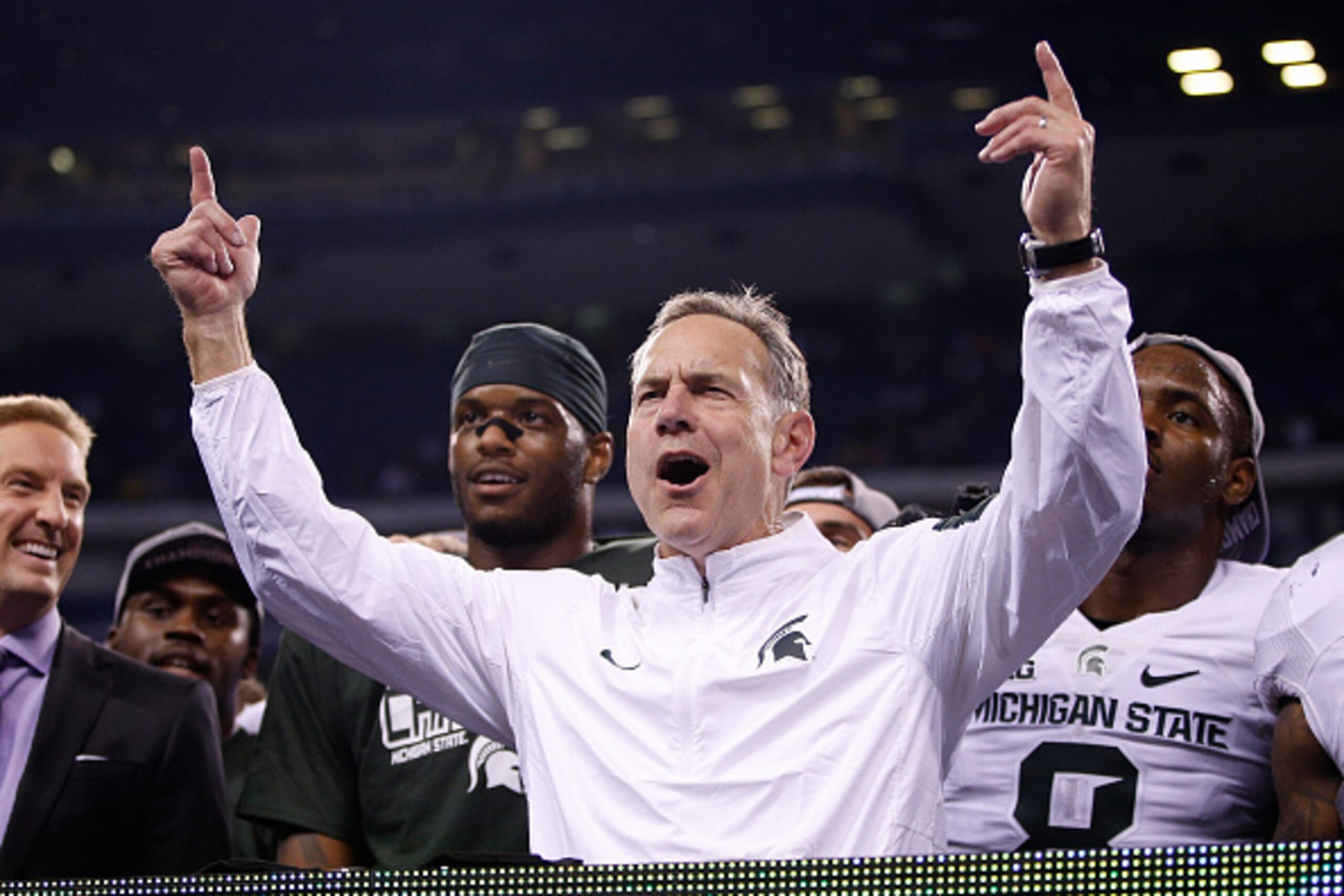 INDIANAPOLIS, IN - DECEMBER 05:  Head coach Mark Dantonio of the Michigan State Spartans celebrates after beating the Iowa Hawkeyes in the Big Ten Championship at Lucas Oil Stadium on December 5, 2015 in Indianapolis, Indiana.  (Photo by Joe Robbins/Getty