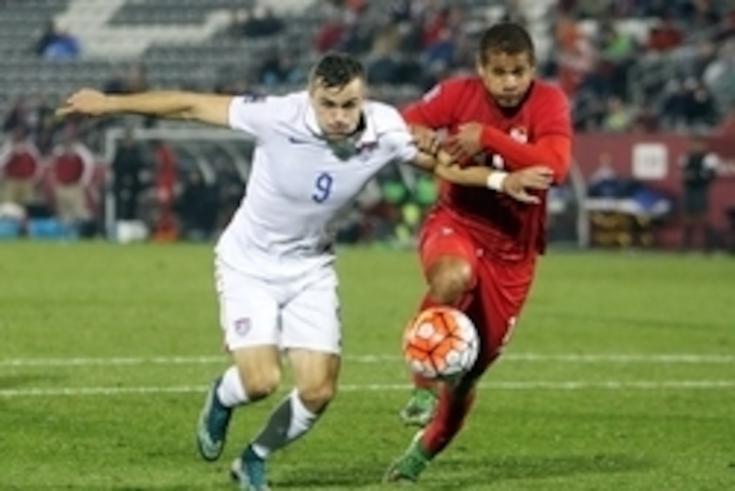 Oct 6, 2015; Commerce City, CO, USA; USA forward Jordan Morris (9) and Panama defender Roberto Chen (14) chase down a ball during the second half at Dick's Sporting Goods Park. The United States won 4-0. Mandatory Credit: Chris Humphreys-USA TODAY Sports